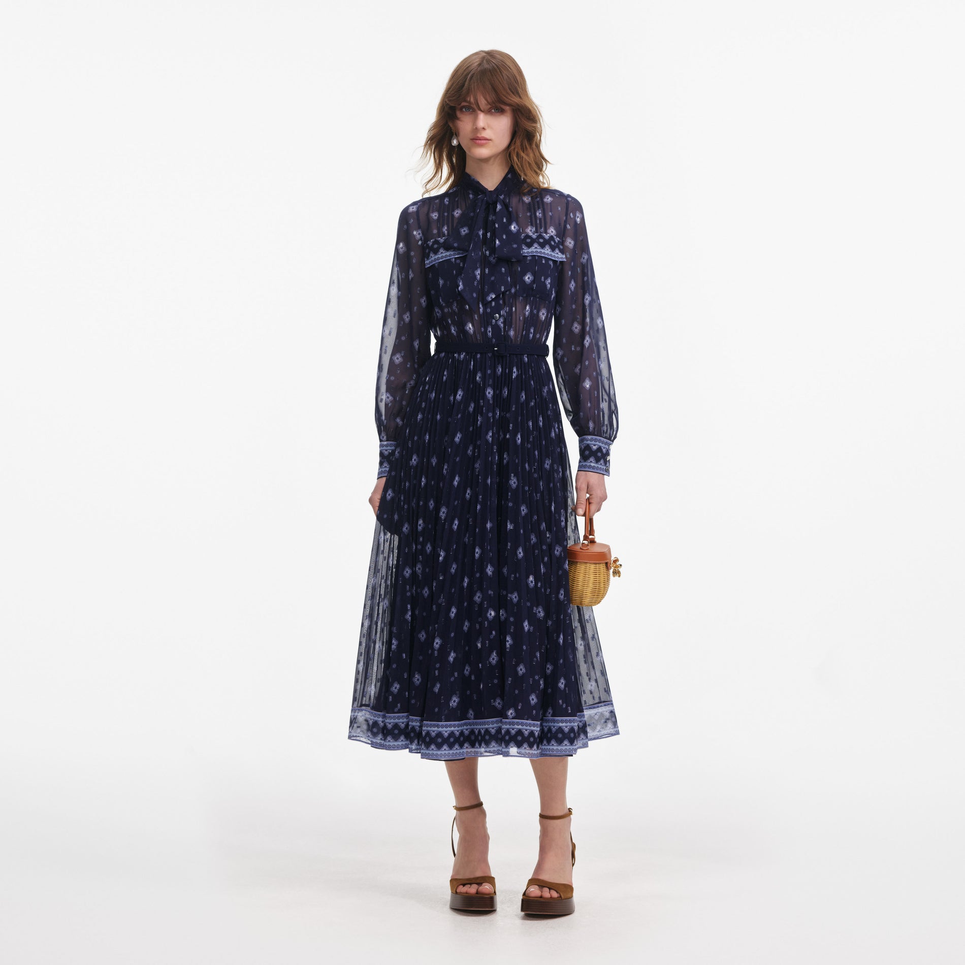 Front view of a woman wearing the Navy Printed Chiffon Midi Dress