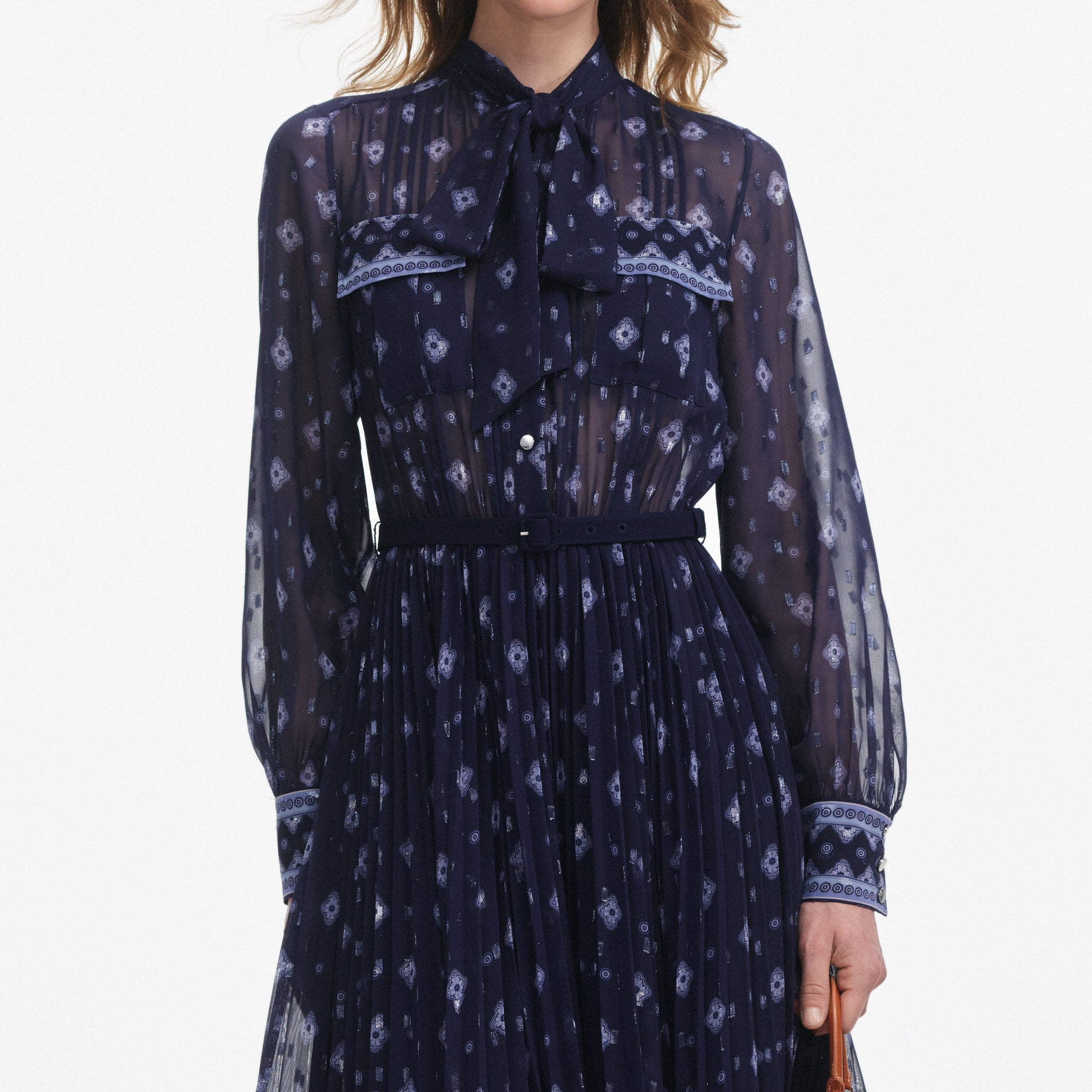A close up of a woman wearing the Navy Printed Chiffon Midi Dress