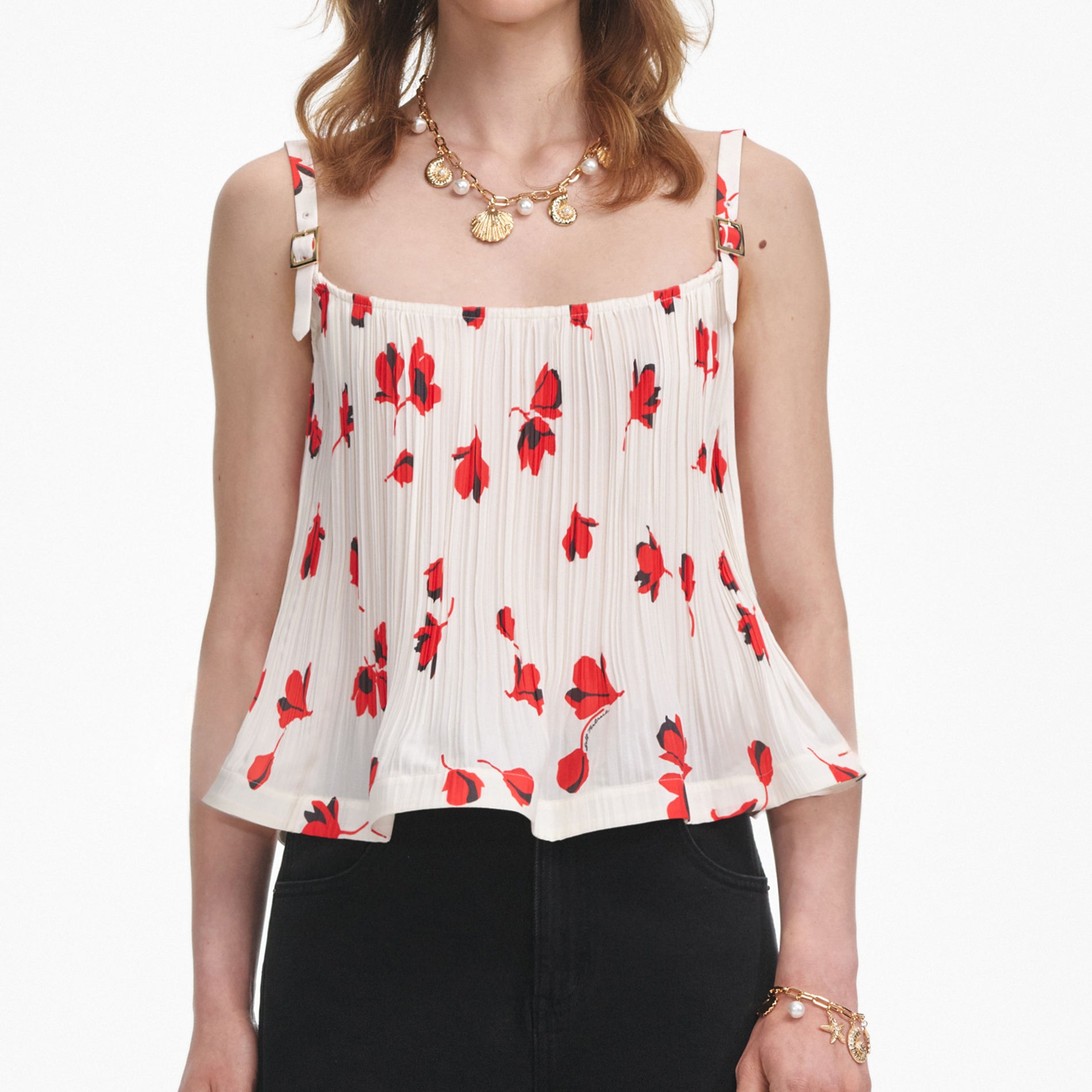 A close up of a woman wearing the White Floral Plisse Top