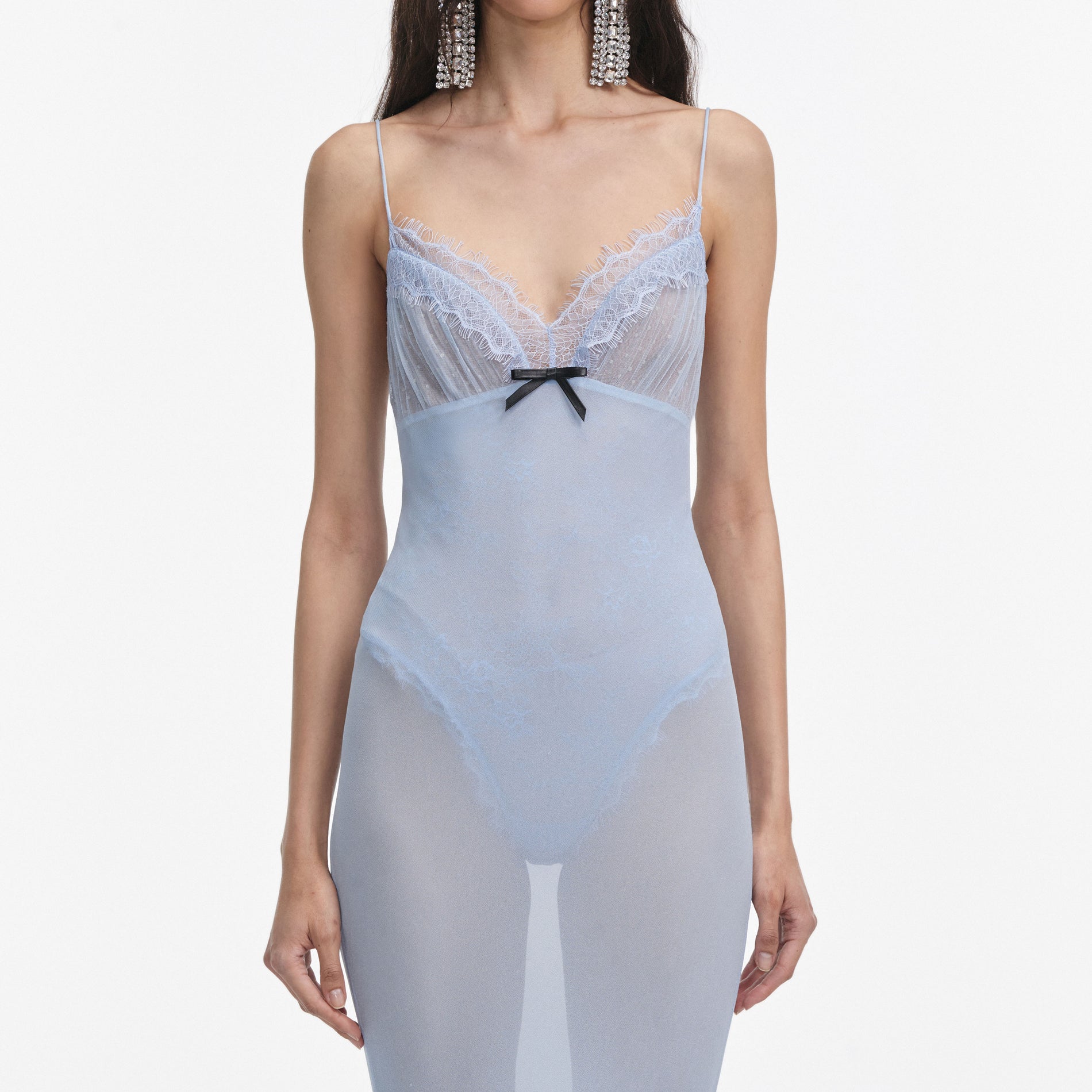 A close up of a woman wearing the Blue Strappy Georgette Maxi Dress