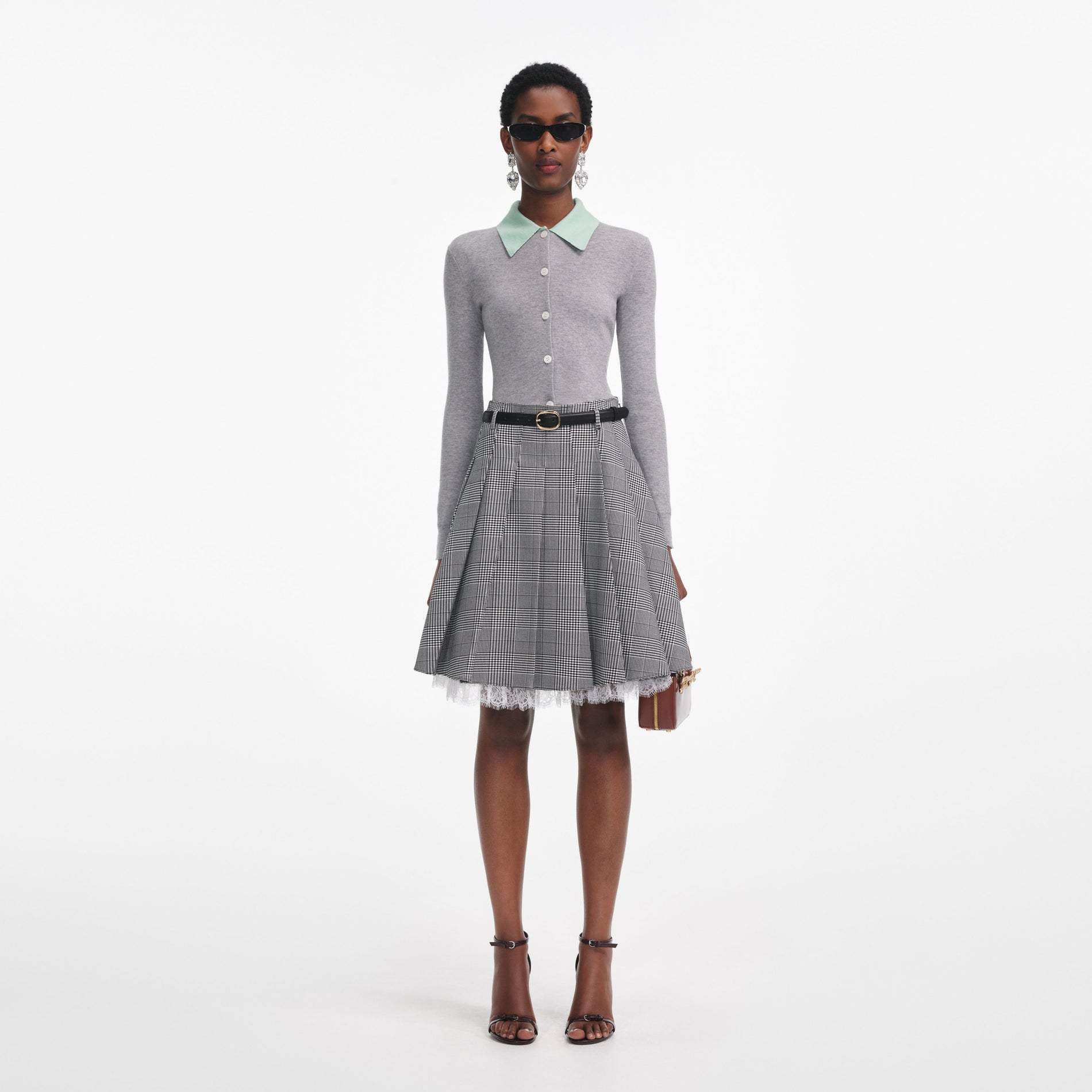 Front view of a woman wearing the Grey Merino Wool Cardigan