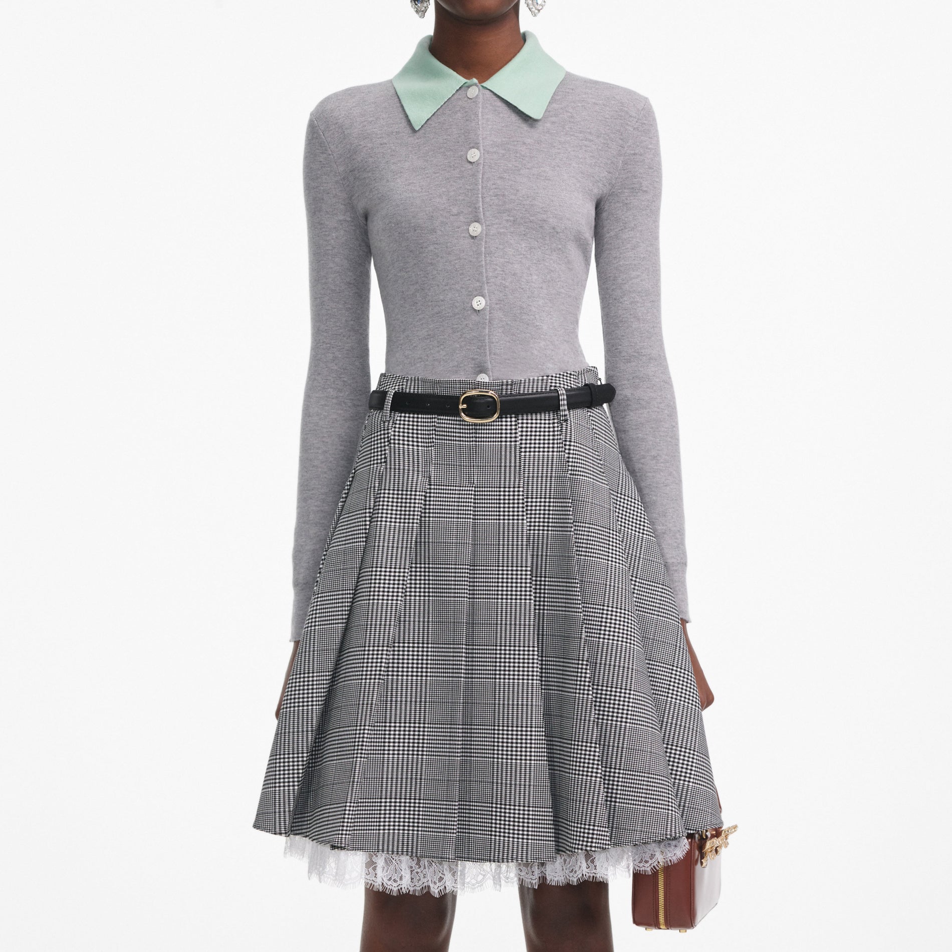 A close up of a woman wearing the Grey Merino Wool Cardigan