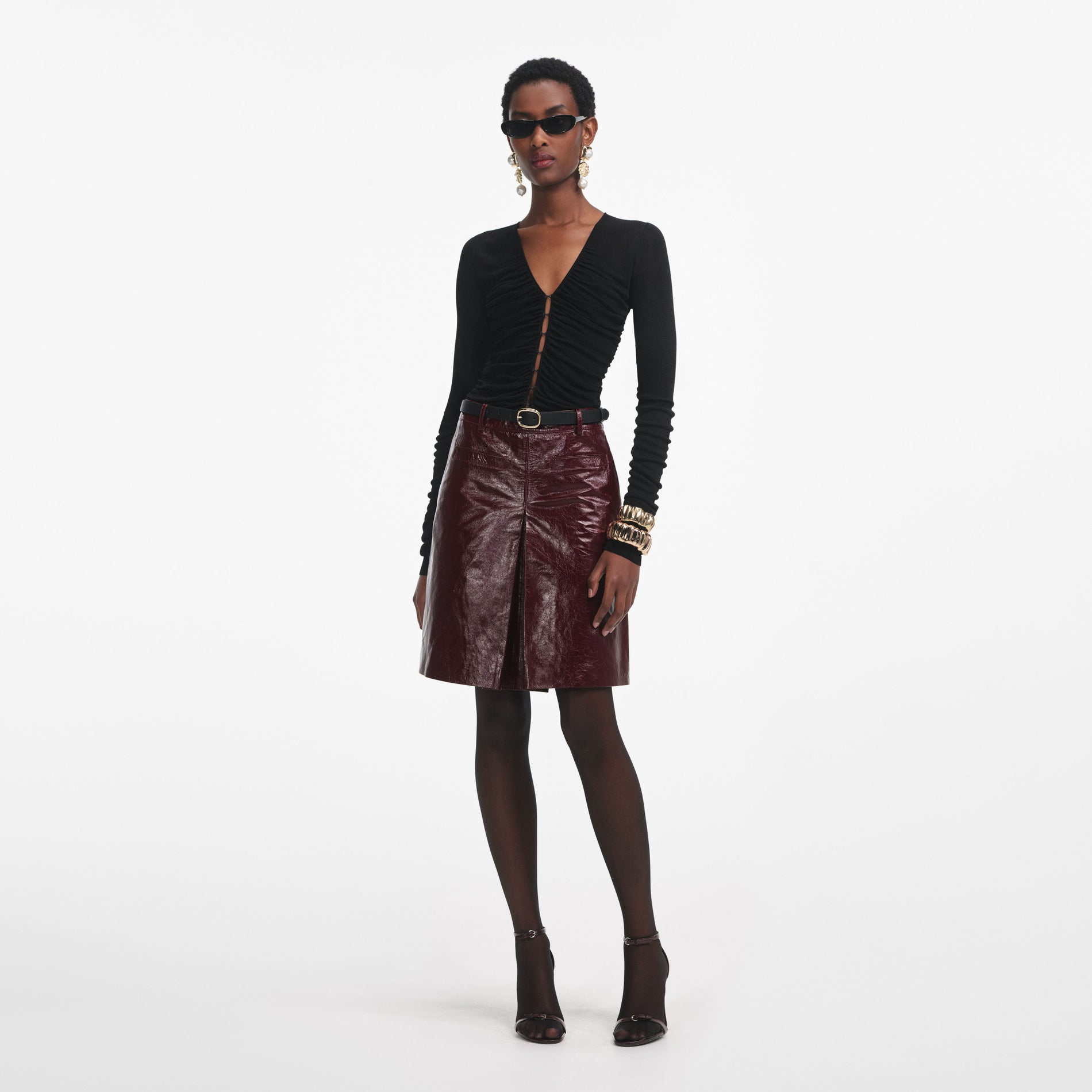 Front view of a woman wearing the Black Viscose Knit Top