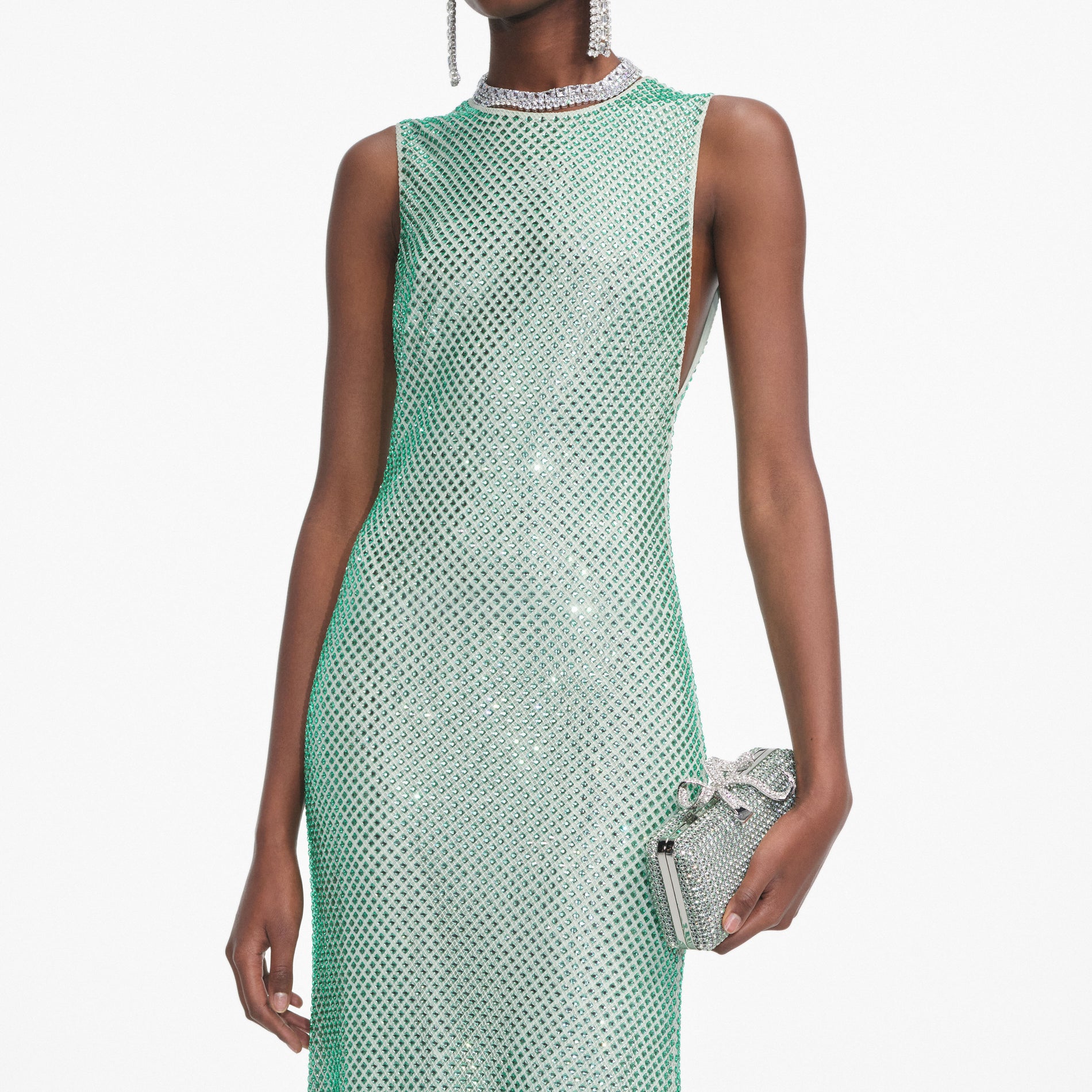 A close up of a woman wearing the Mint Rhinestone Mesh Midi Dress