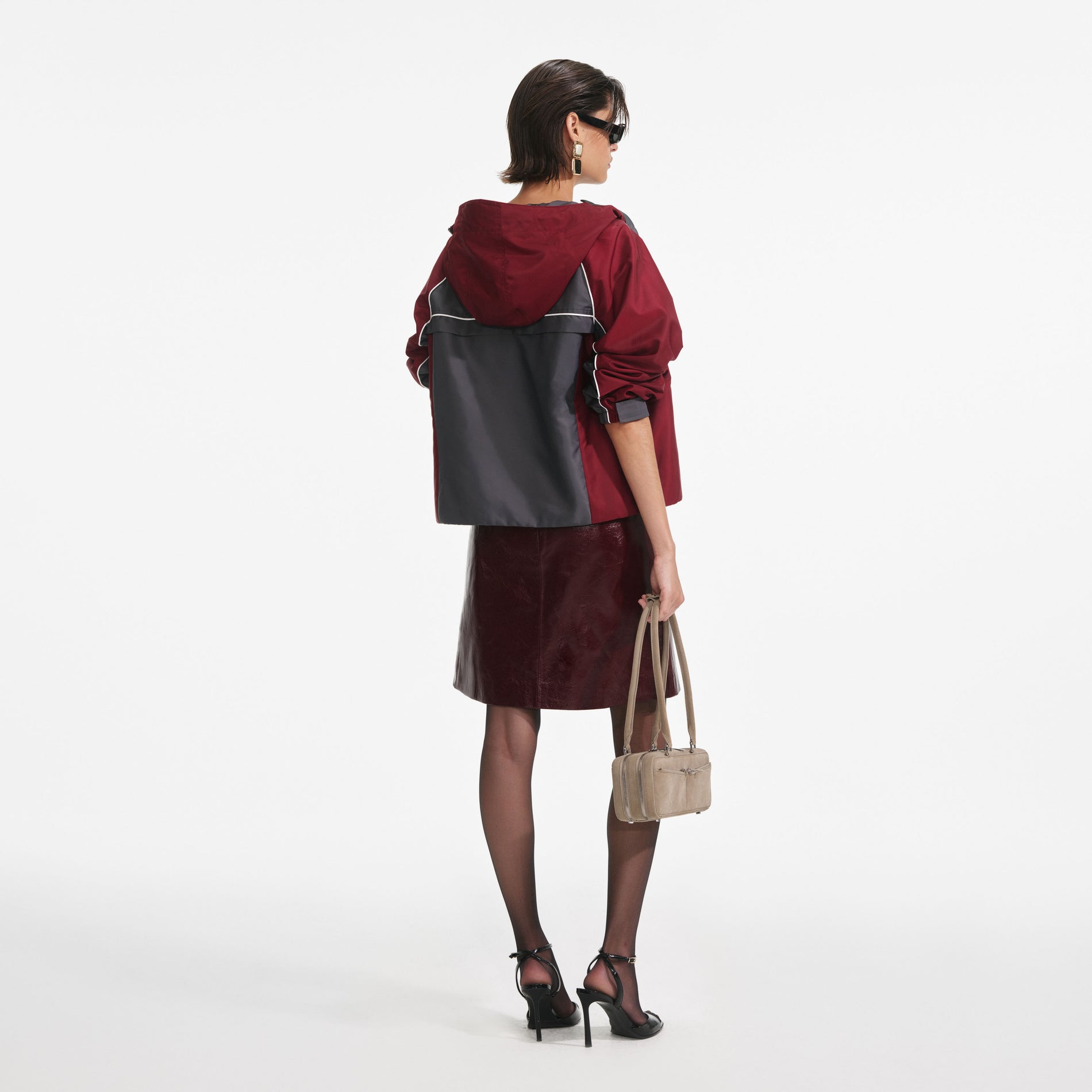 Back view of a woman wearing the Dark Grey Nylon Windbreaker