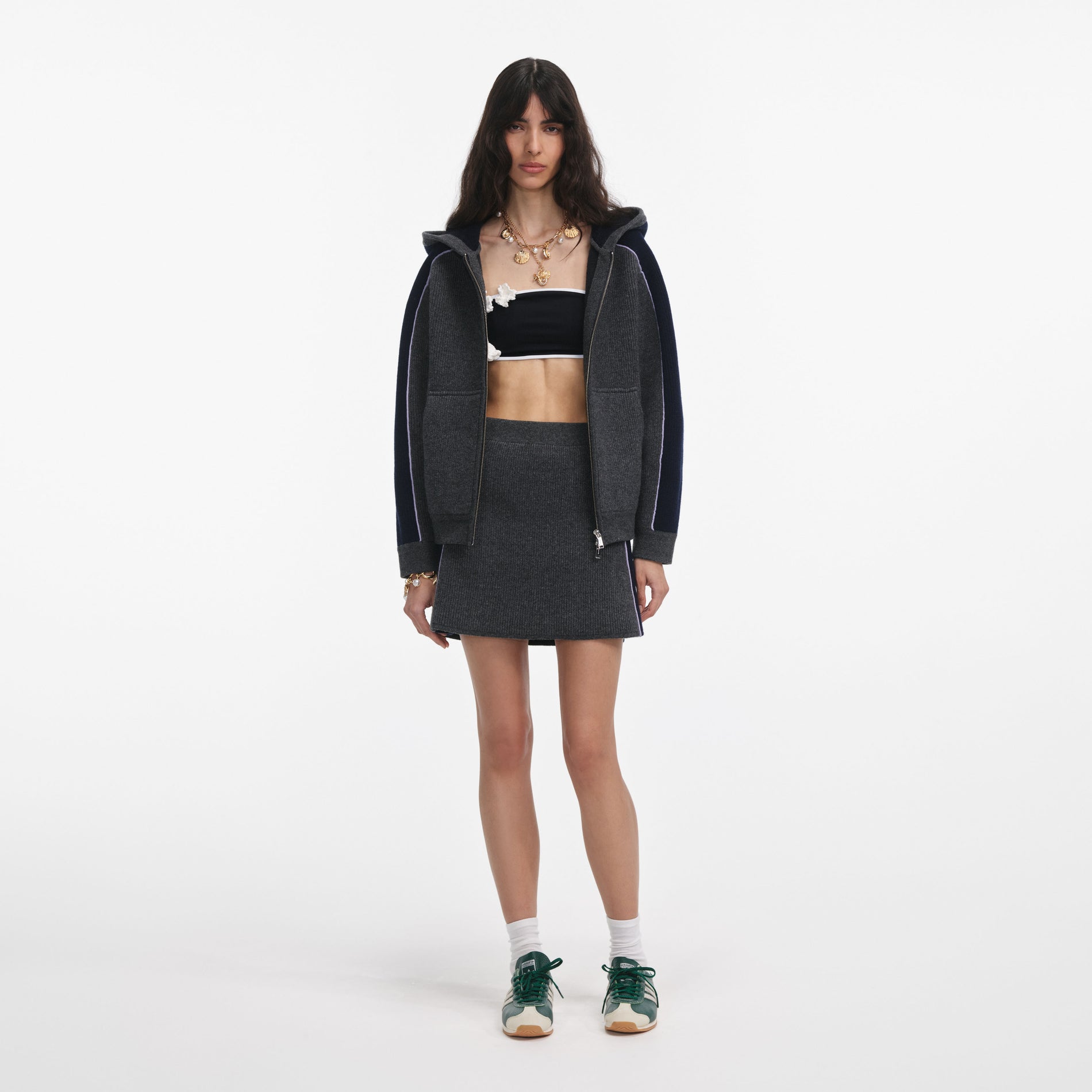 Front view of a woman wearing the Grey Ribbed Knit Mini Skirt