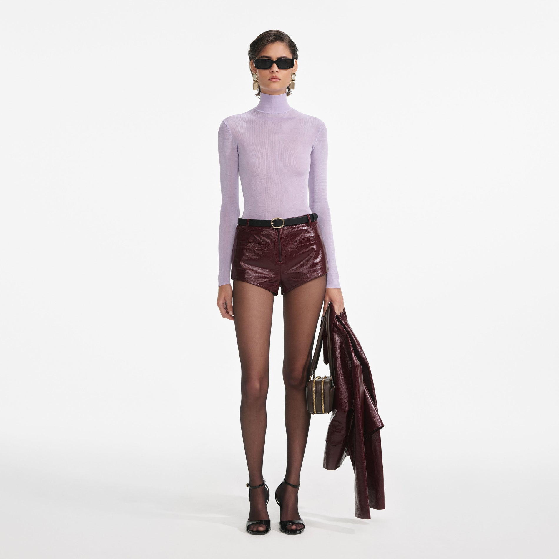 Front view of a woman wearing the Lilac Viscose Knit Top