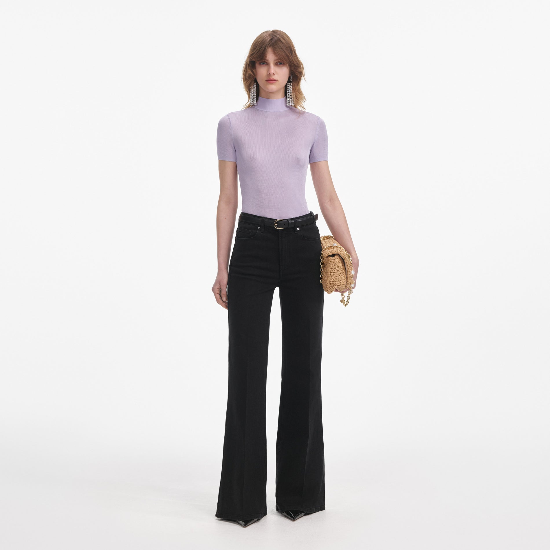 Front view of a woman wearing the Lilac Viscose Knit Short Sleeve Top