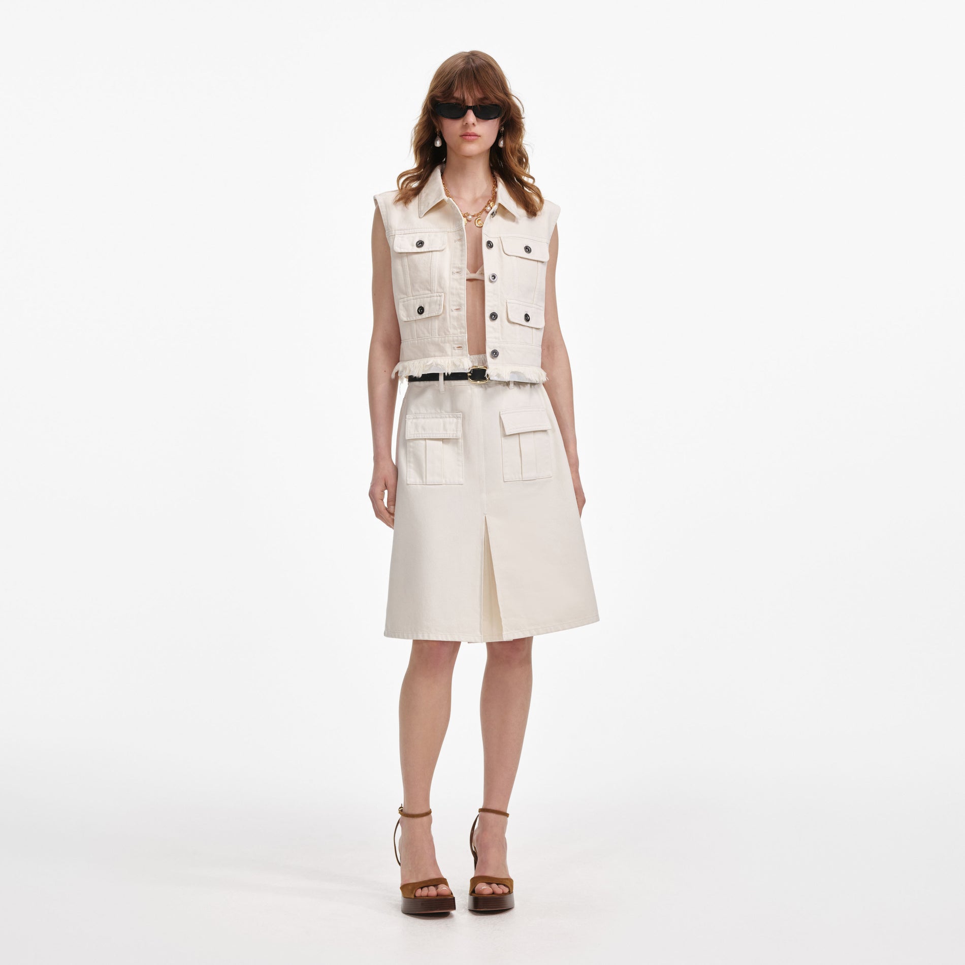 Front view of a woman wearing the Cream Denim Midi Skirt