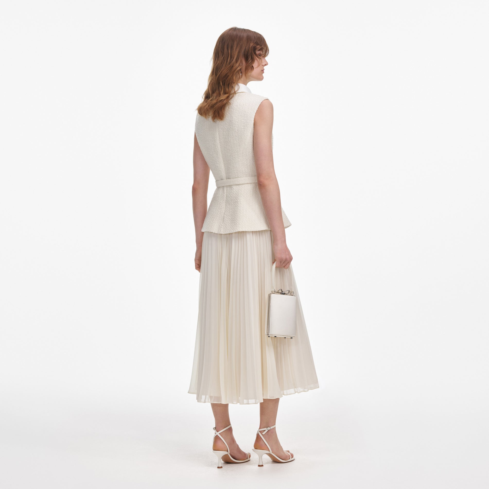 Back view of a woman wearing the Cream Boucle Sleeveless Midi Dress