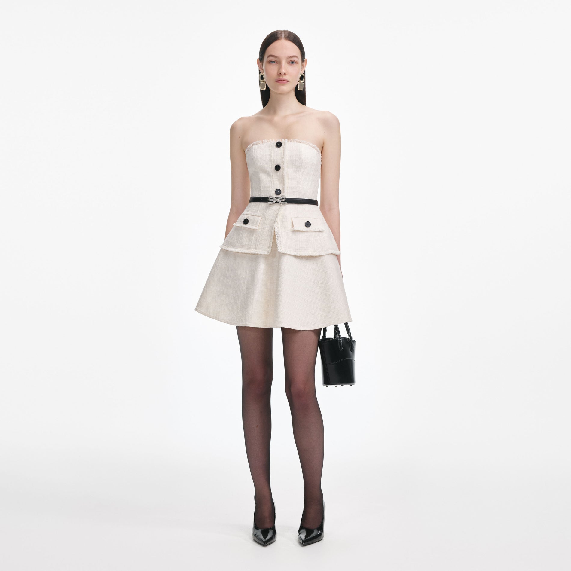 Front view of a woman wearing the Cream Boucle Bandeau Mini Dress