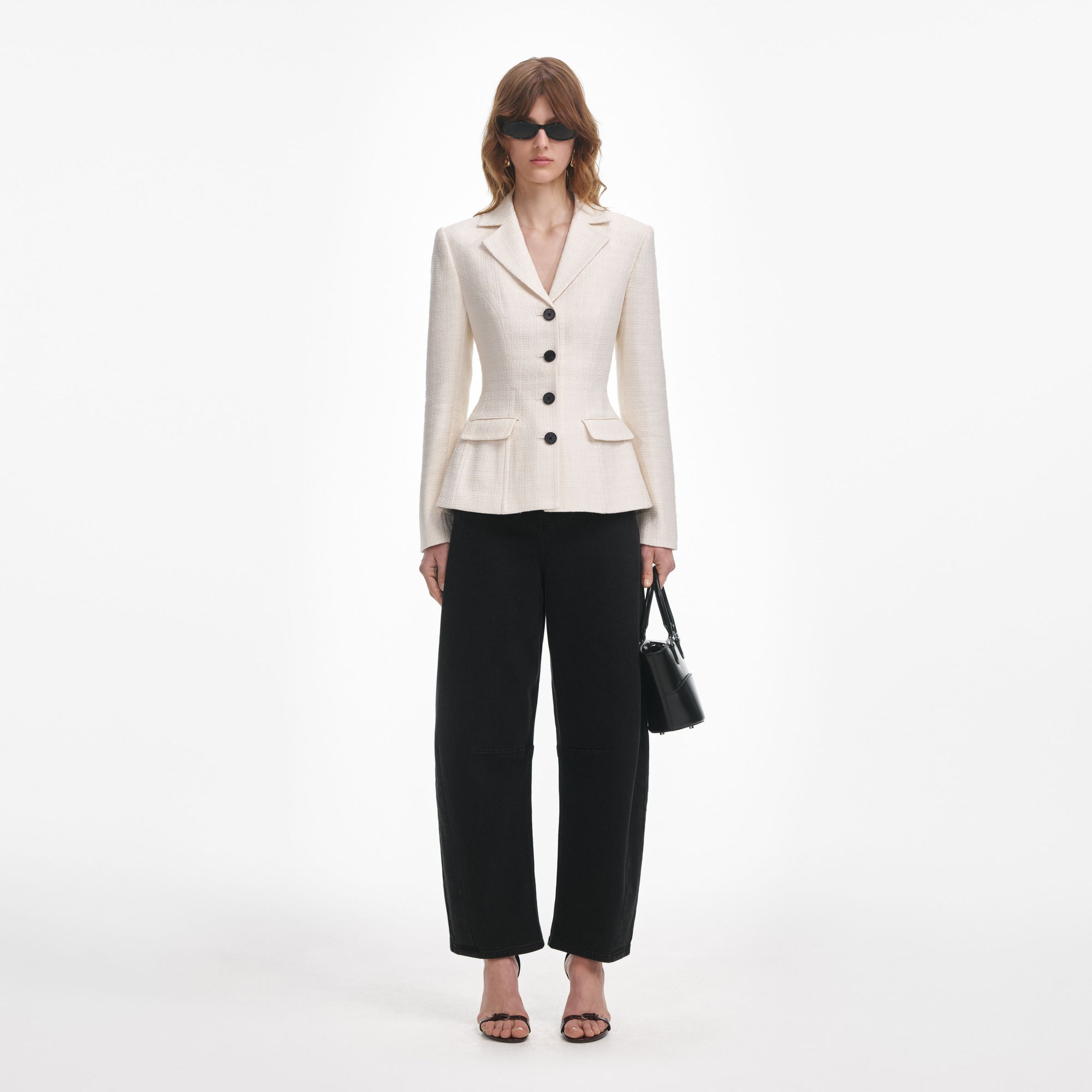 Front view of a woman wearing the Cream Boucle Jacket