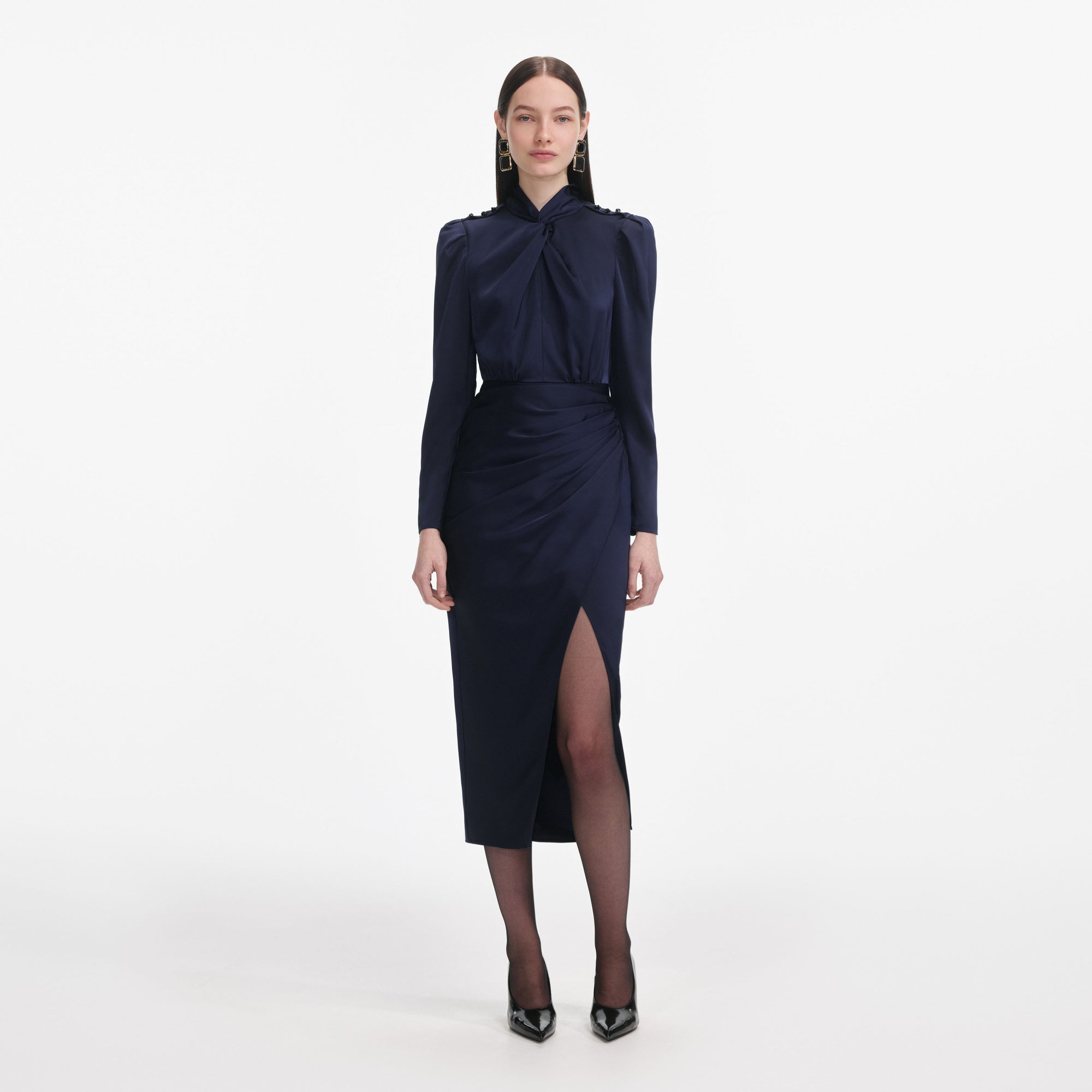 Front view of a woman wearing the Navy Satin Midi Dress