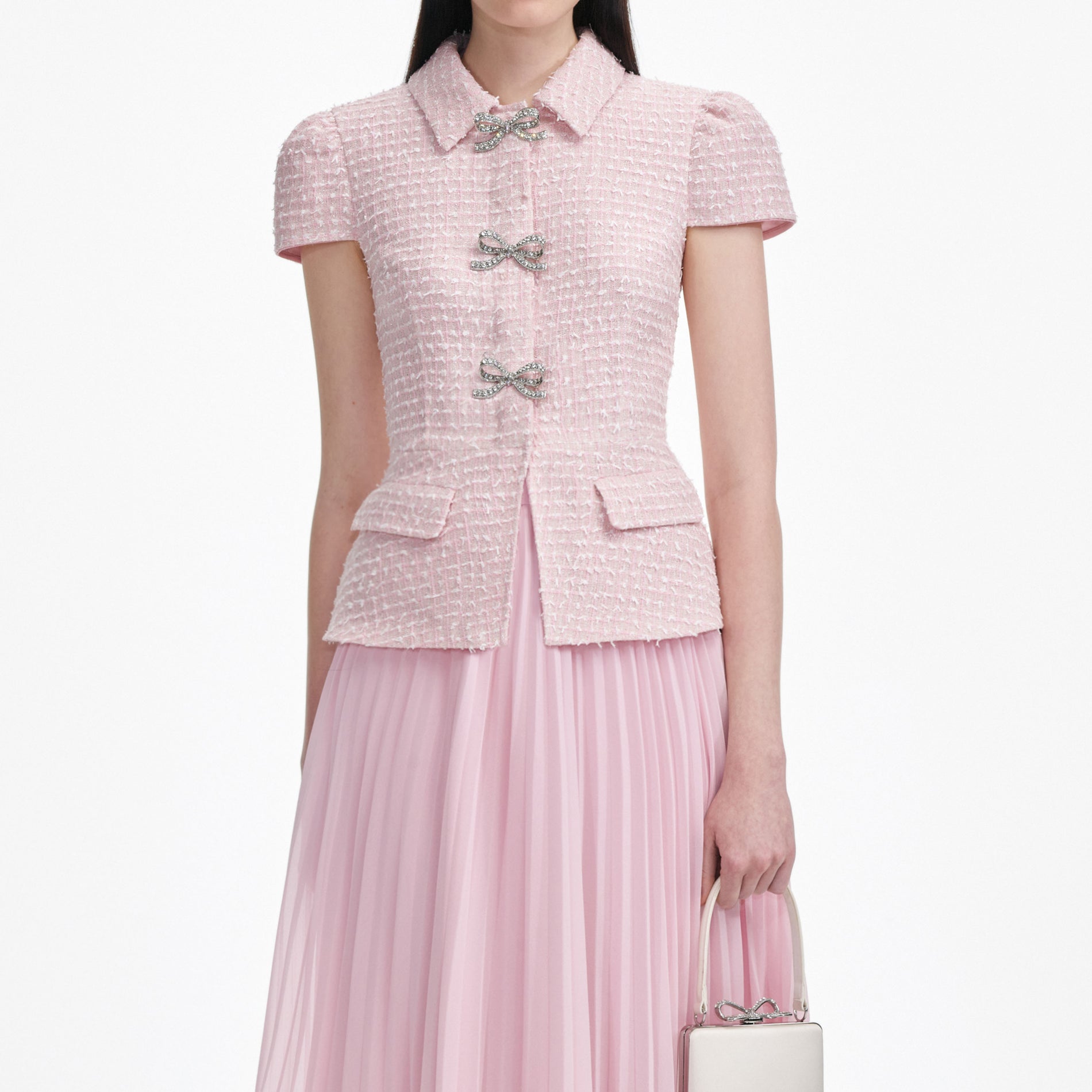 A close up of a woman wearing the Pink Boucle Midi Dress