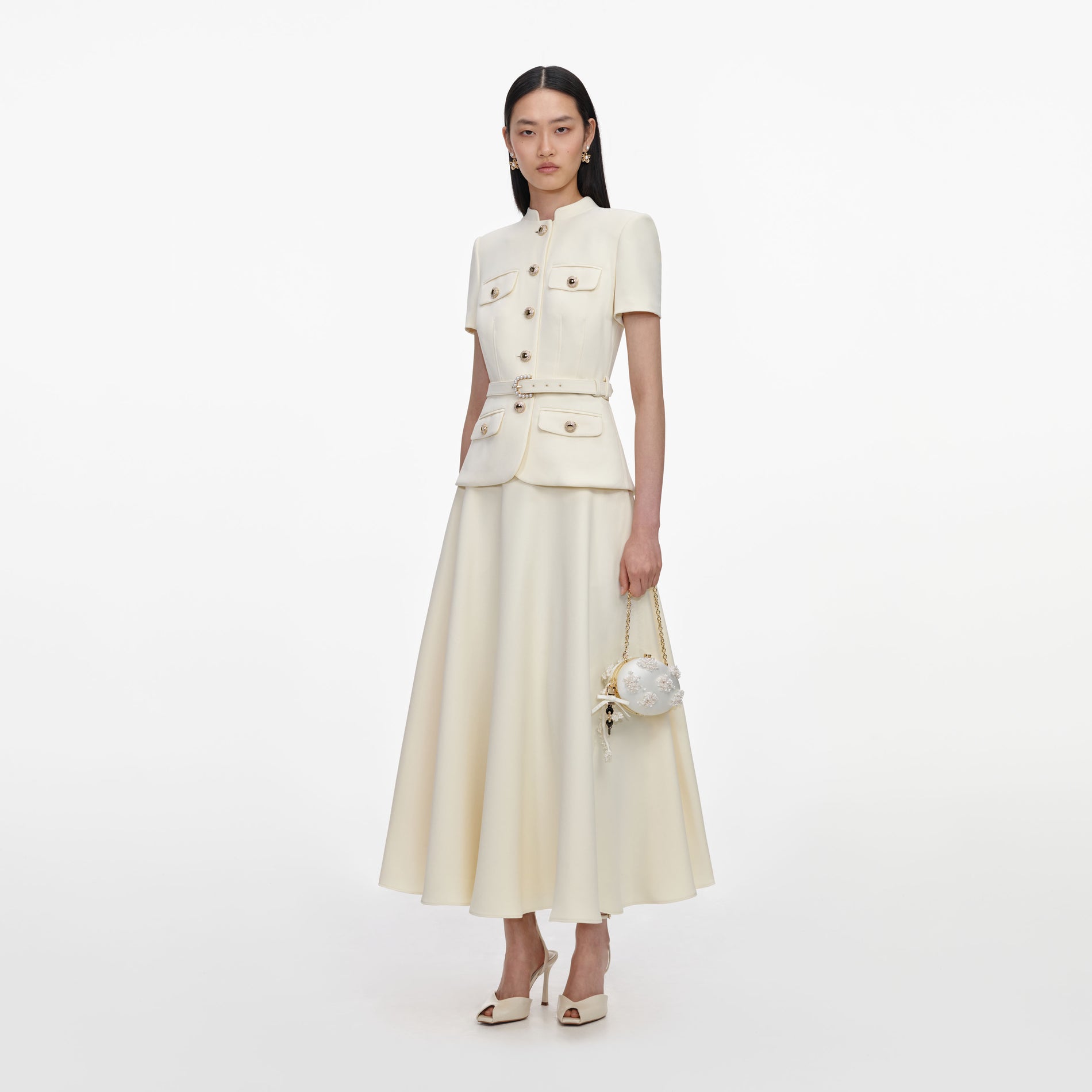 Side view of a woman wearing the Yellow Crepe Tailored Midi Dress