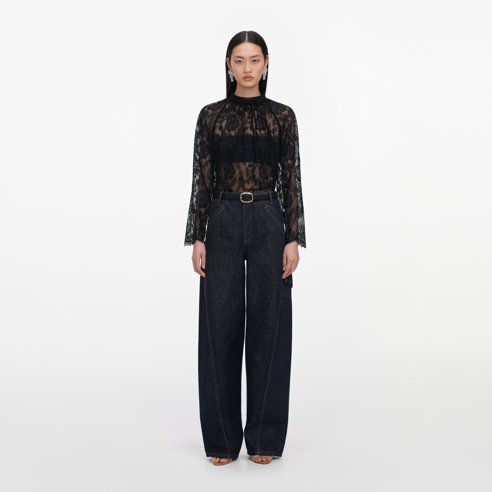 Front view of a woman wearing the Black Lace Blouse