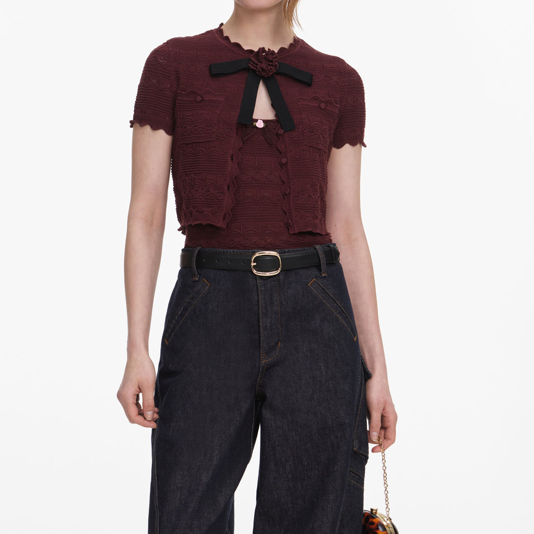 A close up of a woman wearing the Brown Pointelle Knit Top