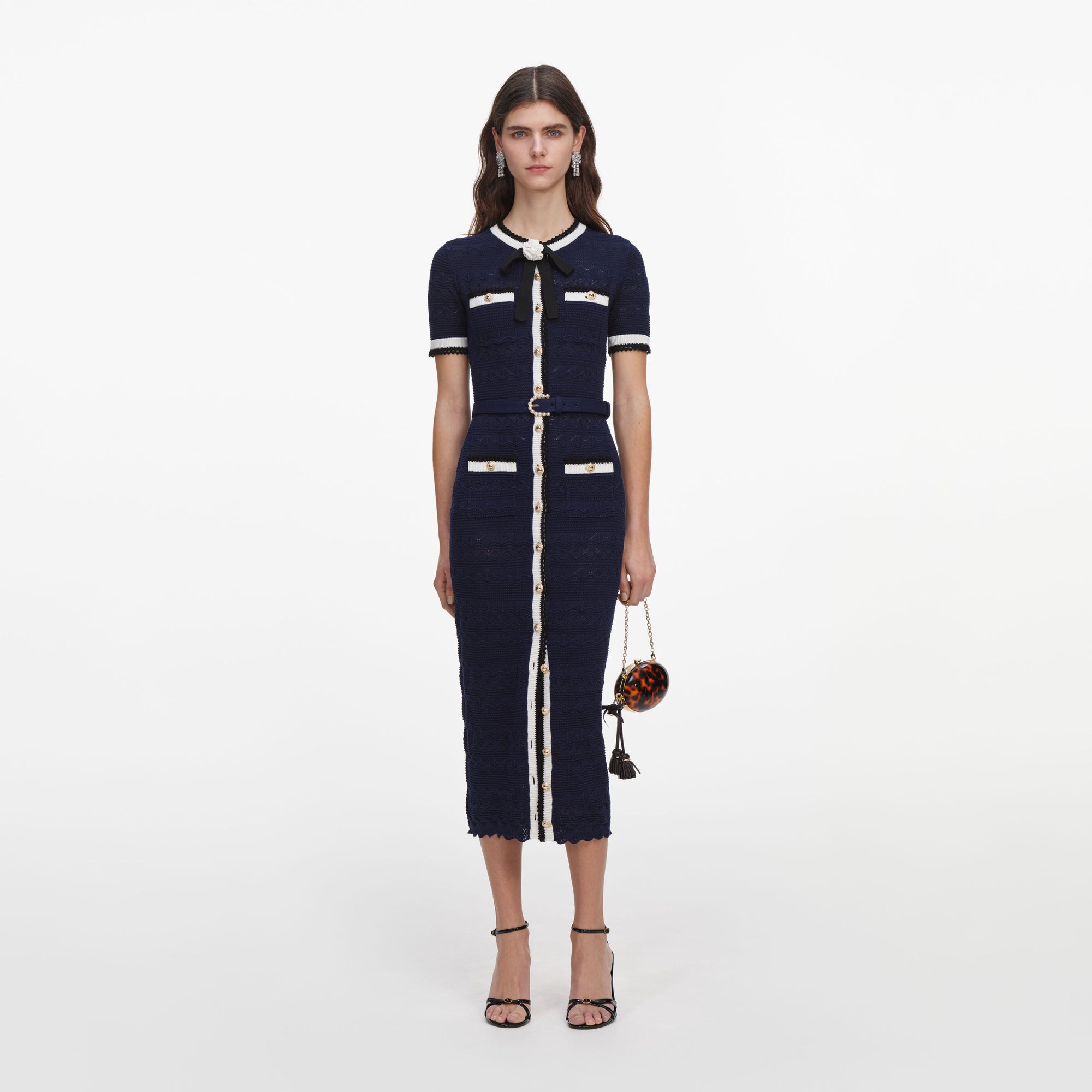 Front view of a woman wearing the Navy Pointelle Knit Midi Dress