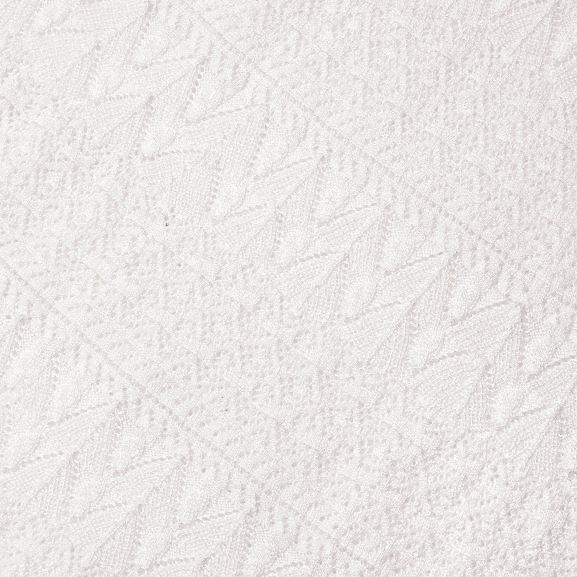 A close up of the fabric for the White Pointelle Knit Midi Skirt