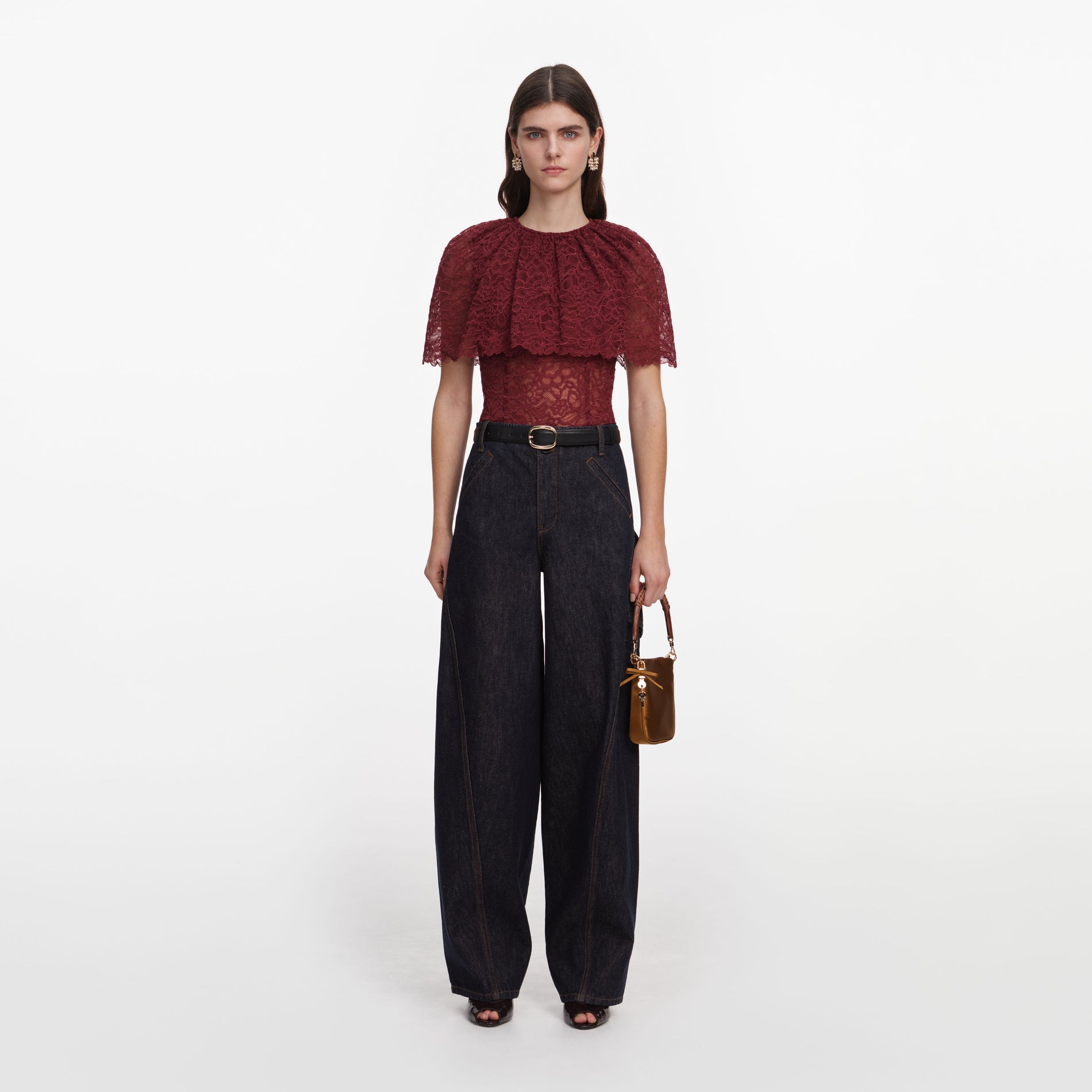 Front view of a woman wearing the Burgundy Lace Cape Top