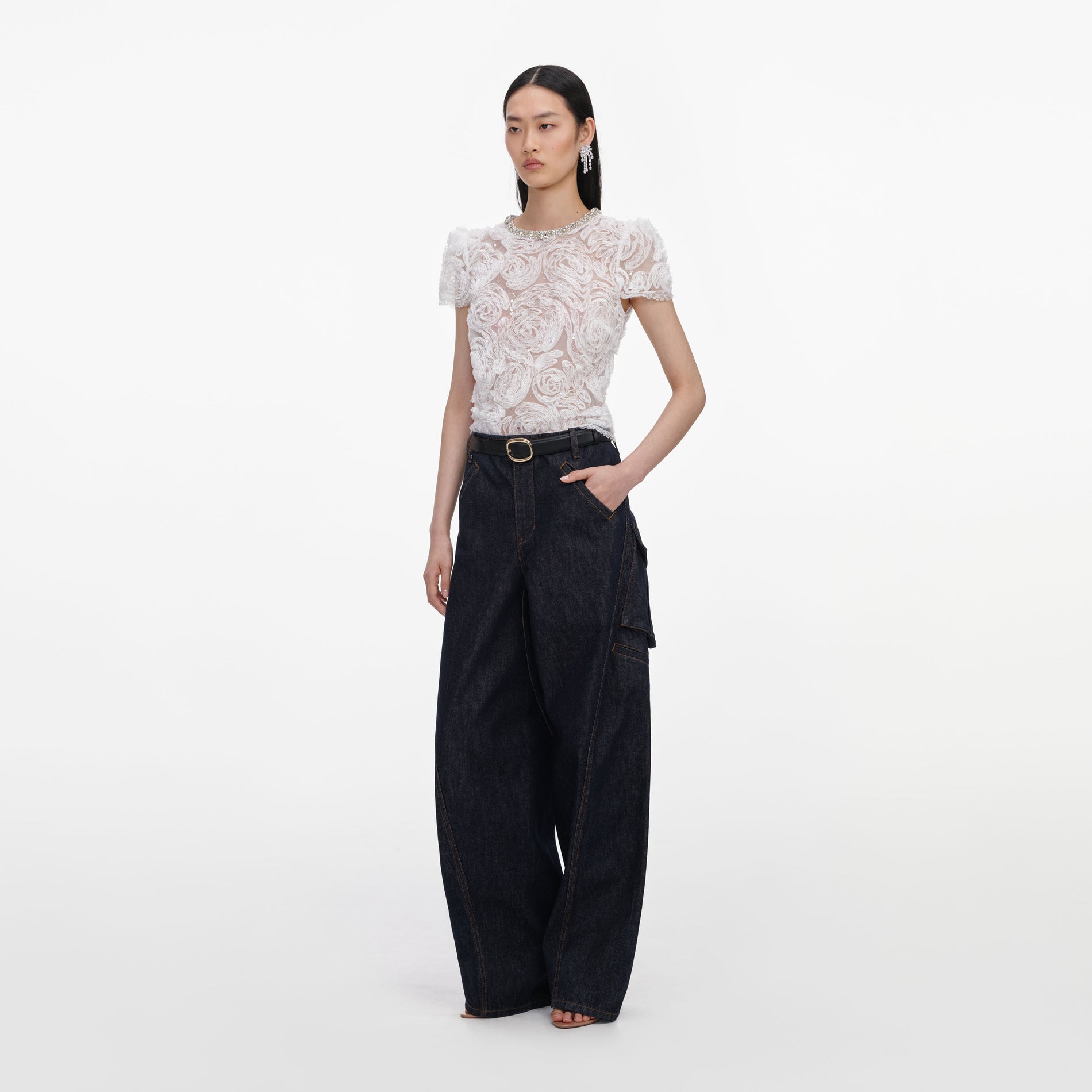 Side view of a woman wearing the White Tulle Lace Top