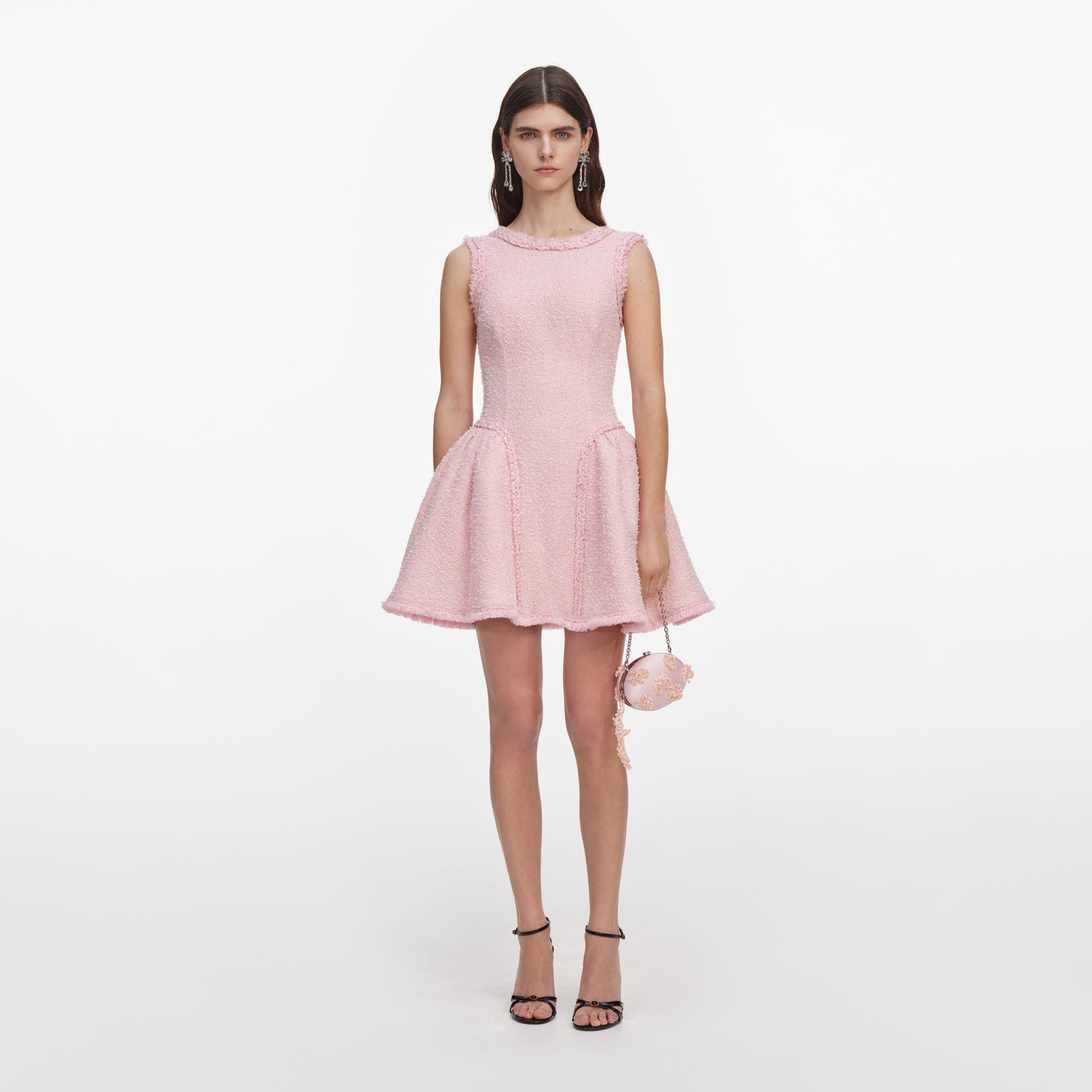 Front view of a woman wearing the Pink Boucle Sleeveless Mini Dress