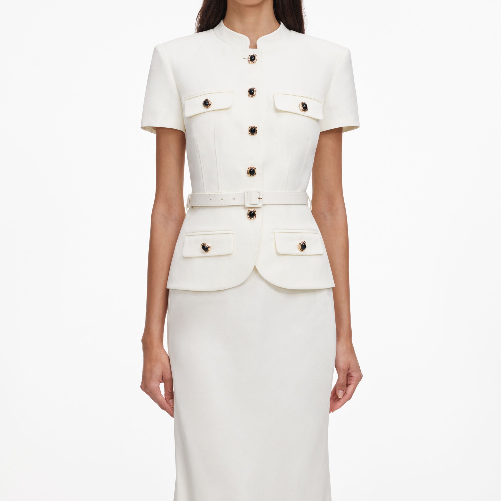 A close up of a woman wearing the Cream Linen Blend Peplum Maxi Dress