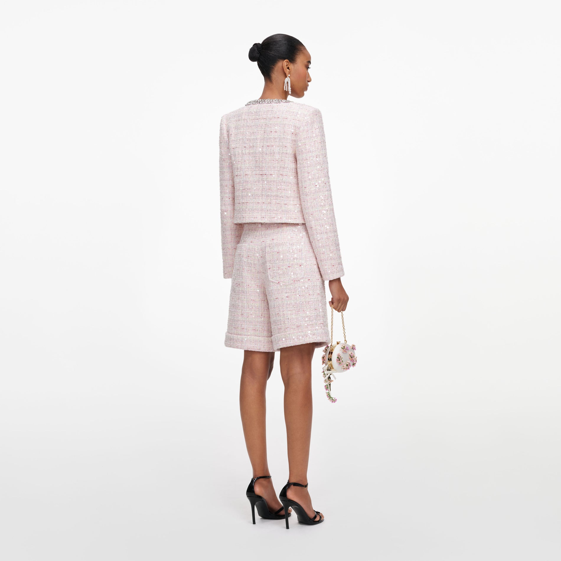 Back view of a woman wearing the Pink Sequin Boucle Shorts