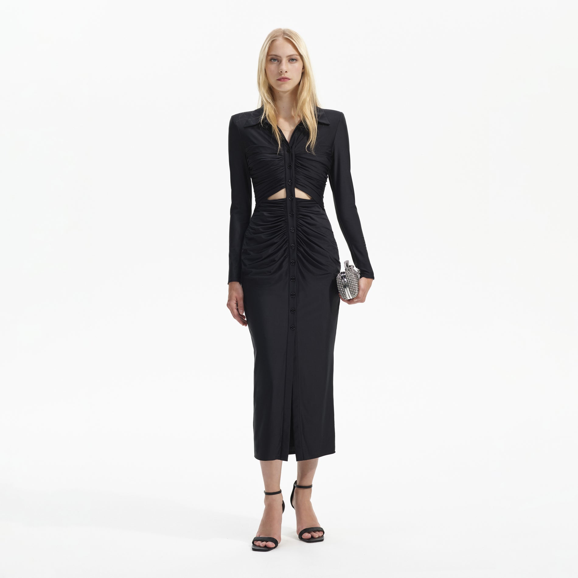 Front view of a woman wearing the Black Jersey Ruched Cut Out Midi Dress