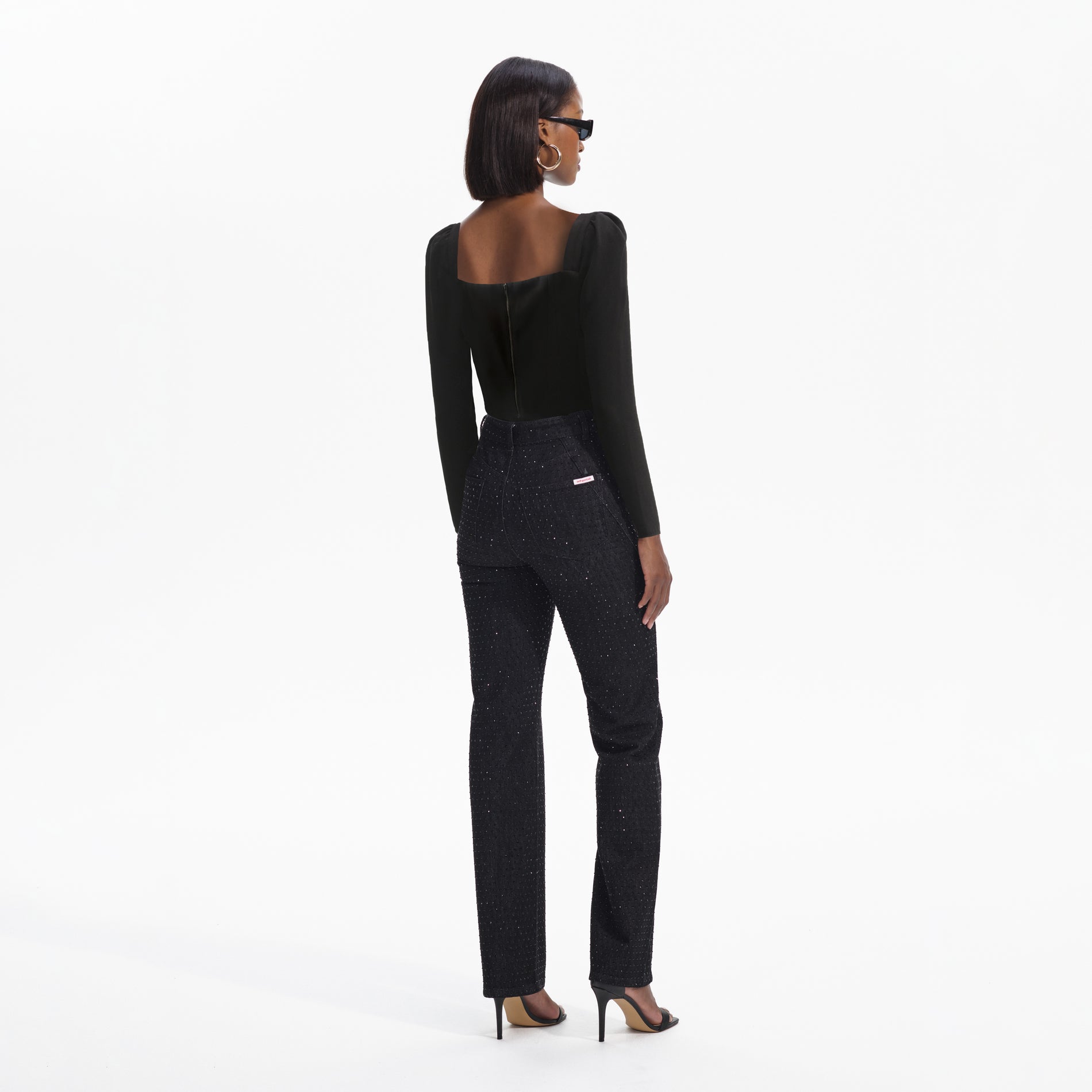 Back view of a woman wearing the Black Diamante Bow Top
