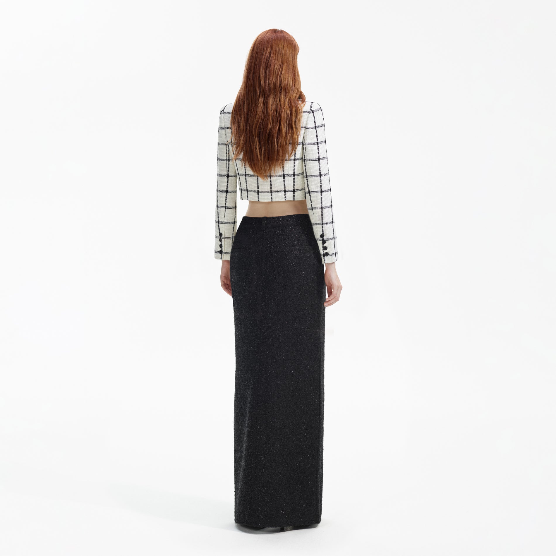 Back view of a woman wearing the Cream Check Jacket