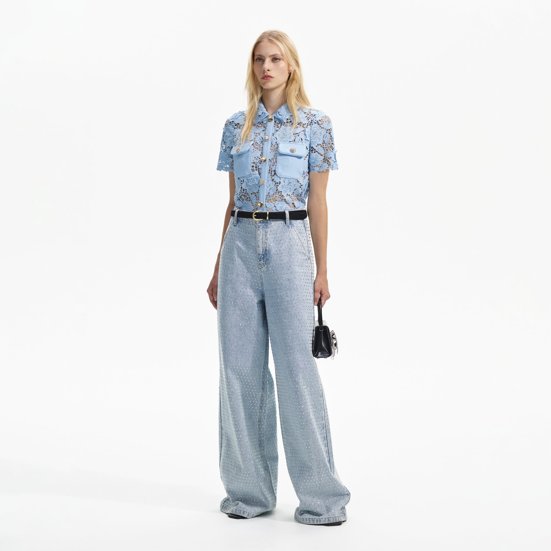 Side view of a woman wearing the Blue Lace Collar Top