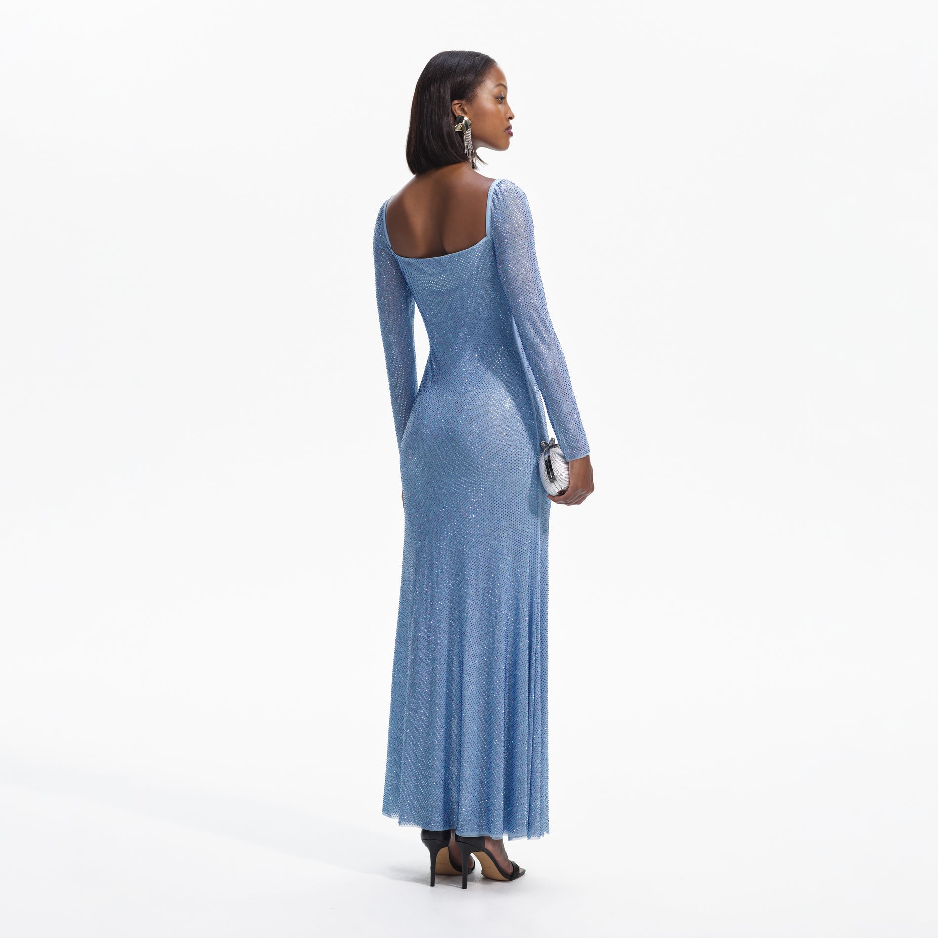 Back view of a woman wearing the Blue Iridescent Rhinestone Maxi Dress