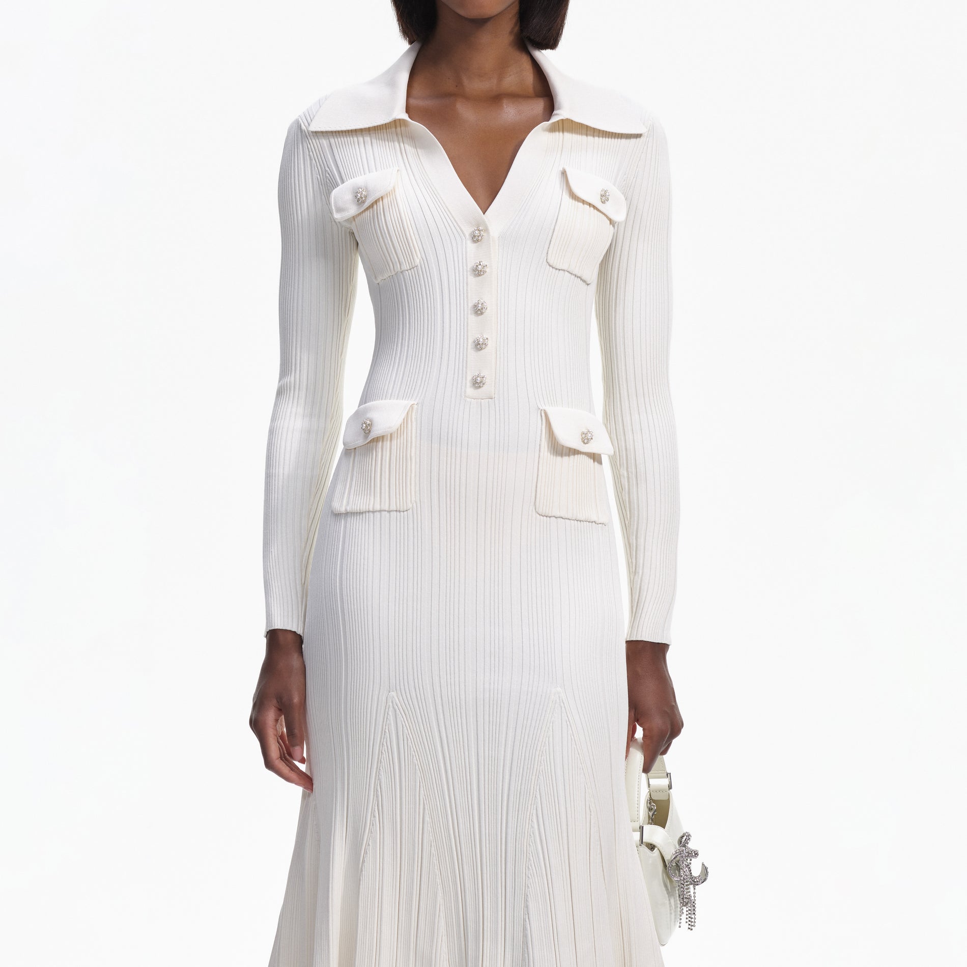 A close up of a woman wearing the Cream Knit Midi Dress