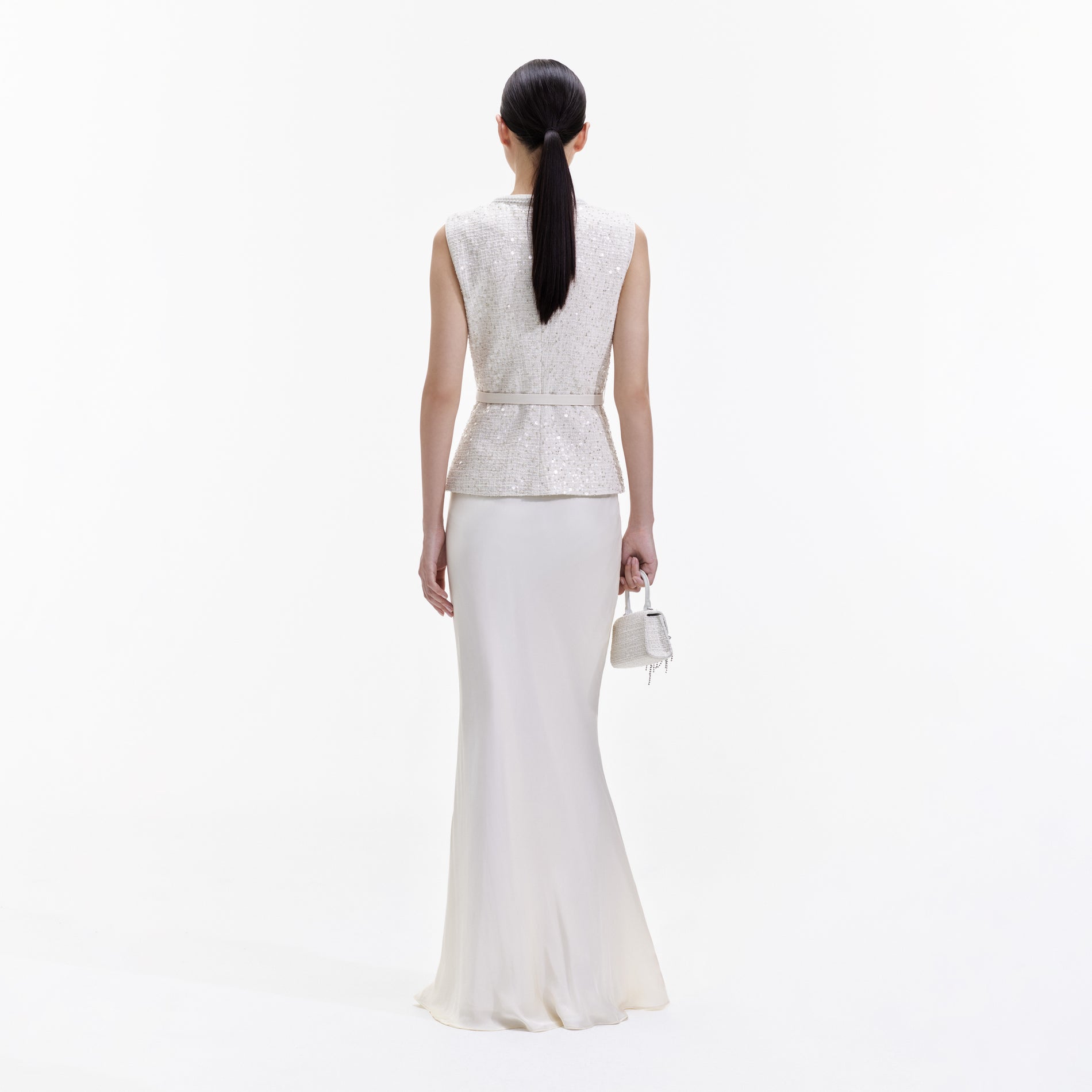Back view of a woman wearing the Cream Sequin Boucle Maxi Dress