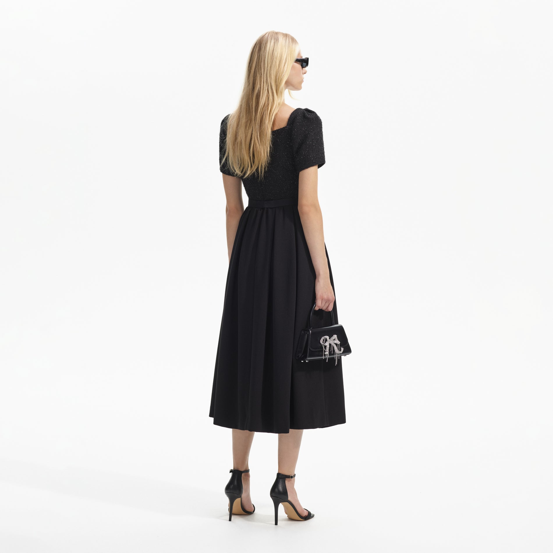 Back view of a woman wearing the Black Boucle Square Neck Midi Dress