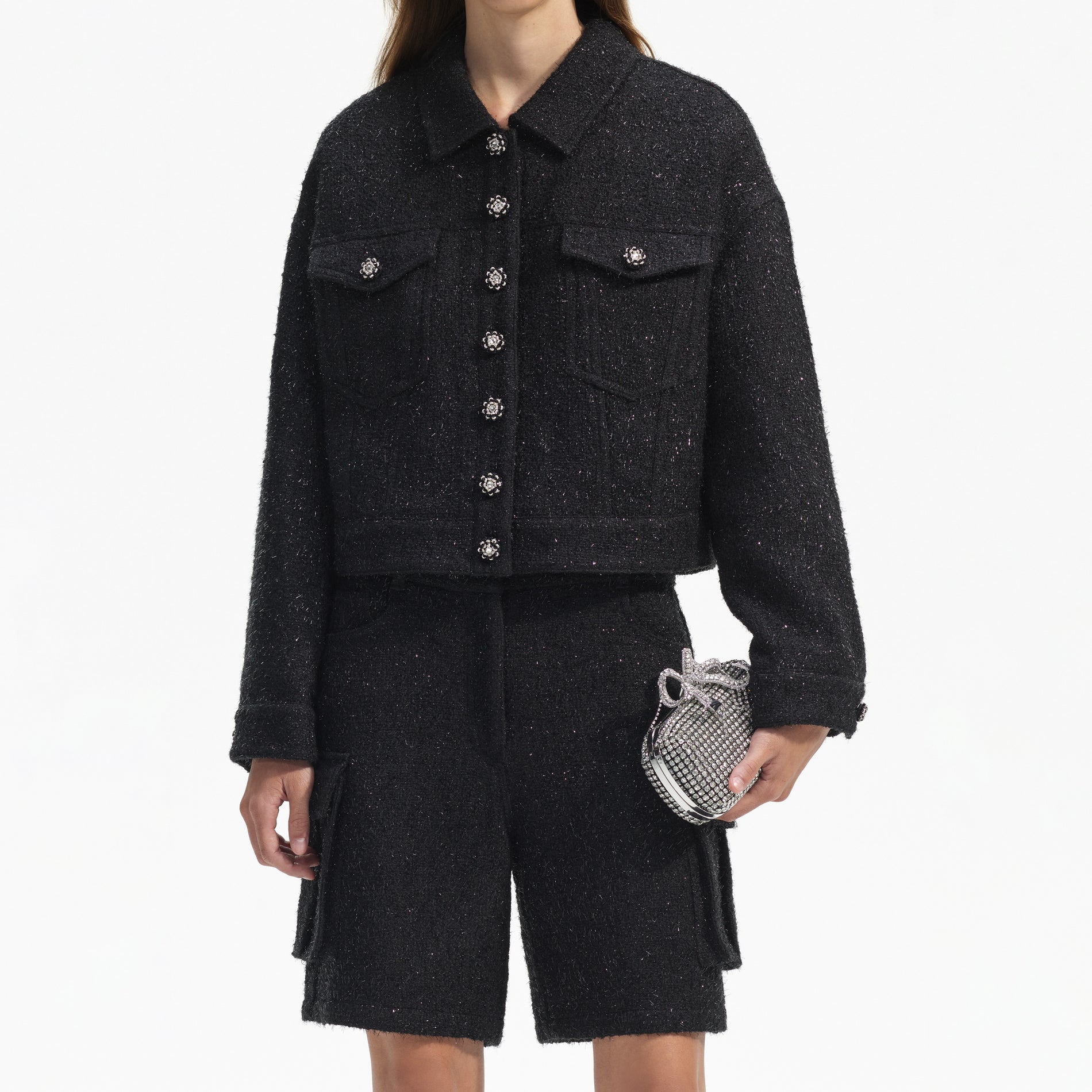 A close up of a woman wearing the Black Boucle Oversized Jacket