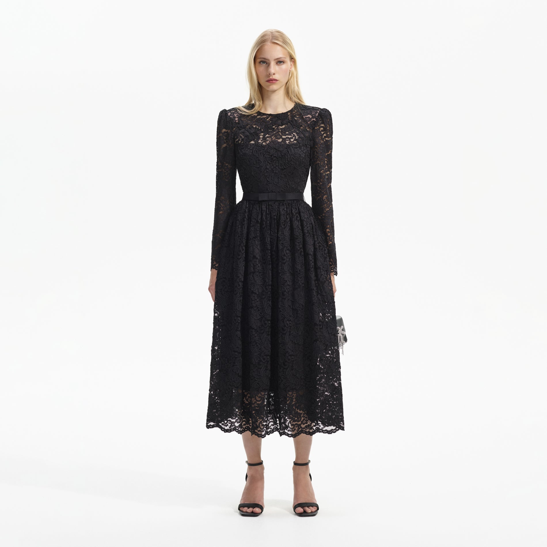 Front view of a woman wearing the Black Cord Lace Long Sleeve Midi Dress