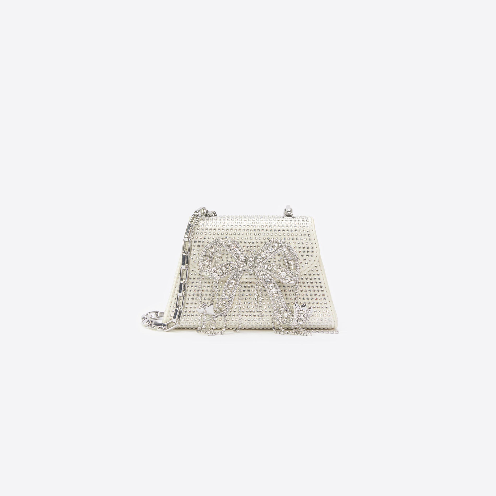 Front view of a woman wearing the Cream Rhinestone Micro Bow Bag