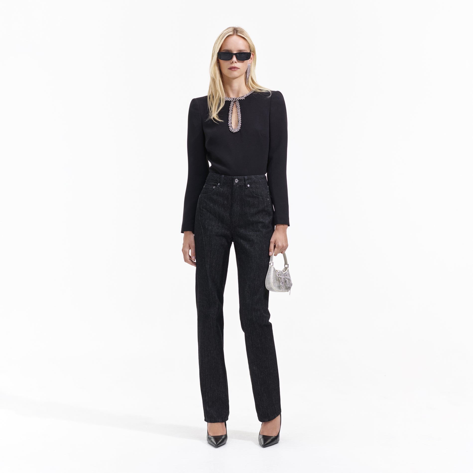 Front view of a woman wearing the Black Denim Jeans