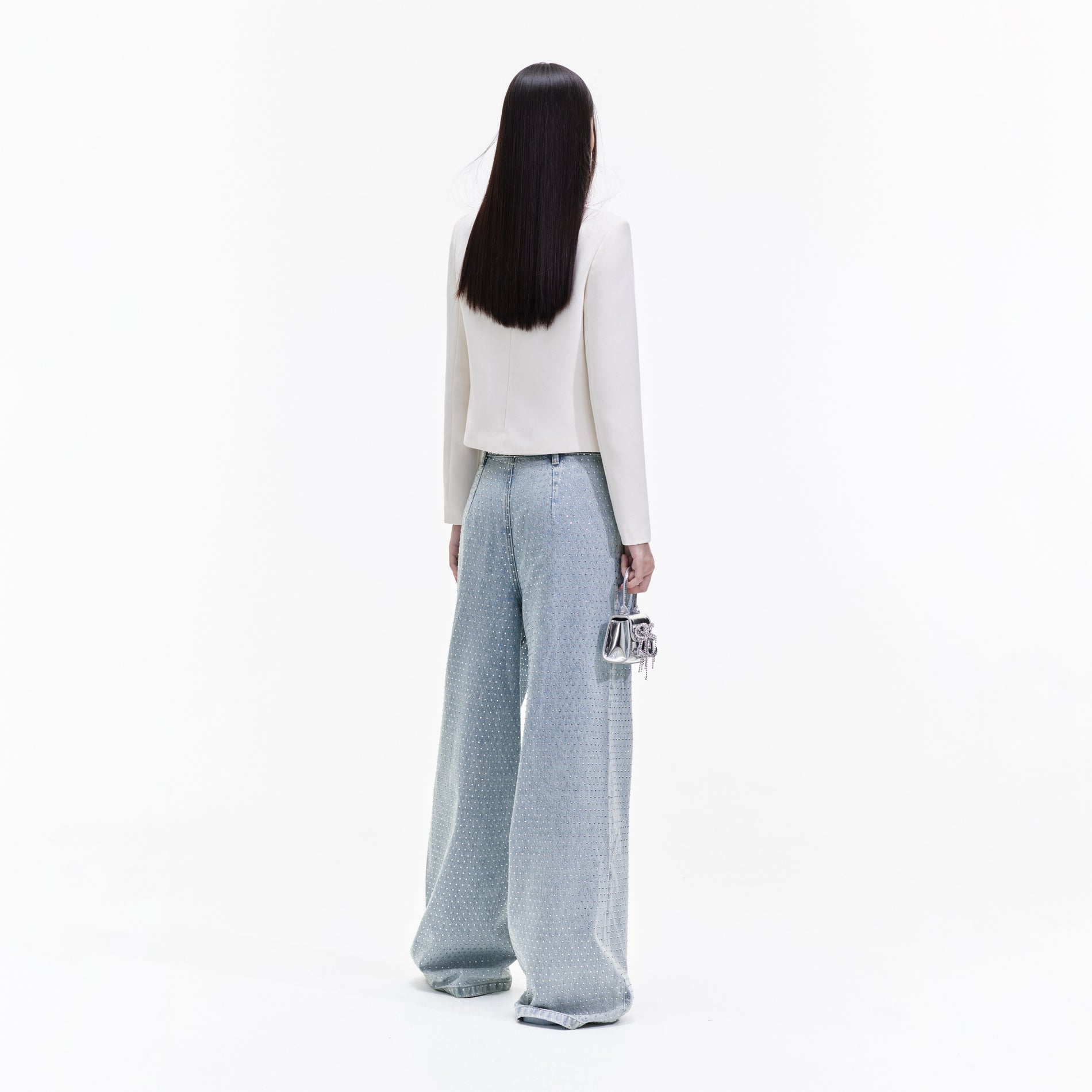 Back view of a woman wearing the Cream Crepe Diamante Top