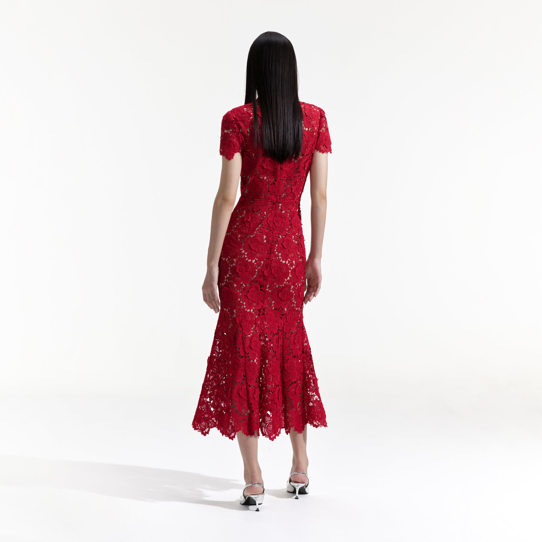 Back view of a woman wearing the Red Flower Lace Midi Dress