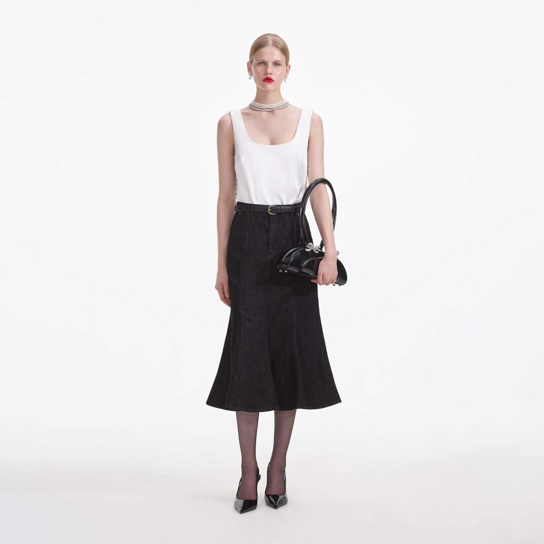 Front view of a woman wearing the White Bonded Satin Vest