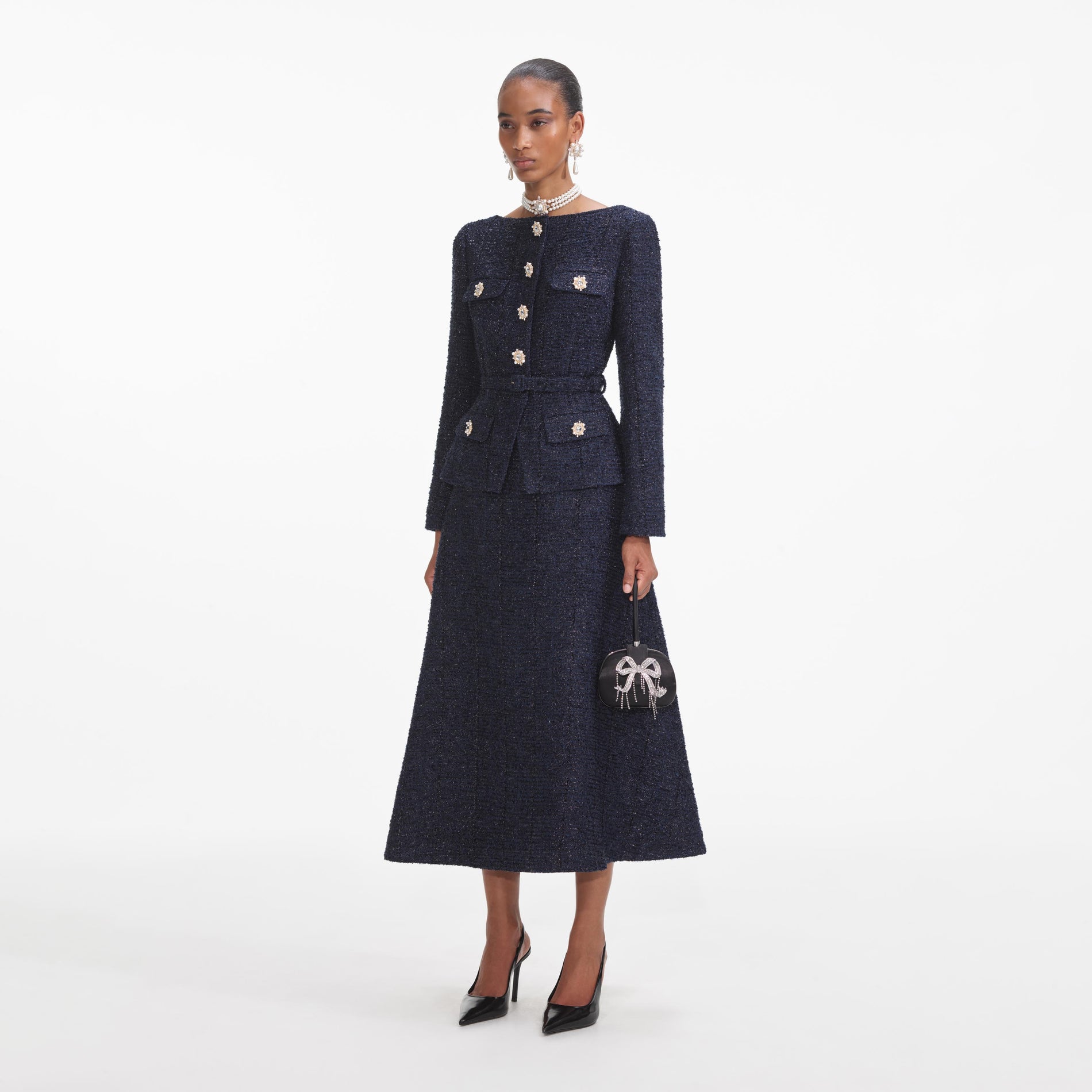 Side view of a woman wearing the Navy Metallic Boucle Midi Dress