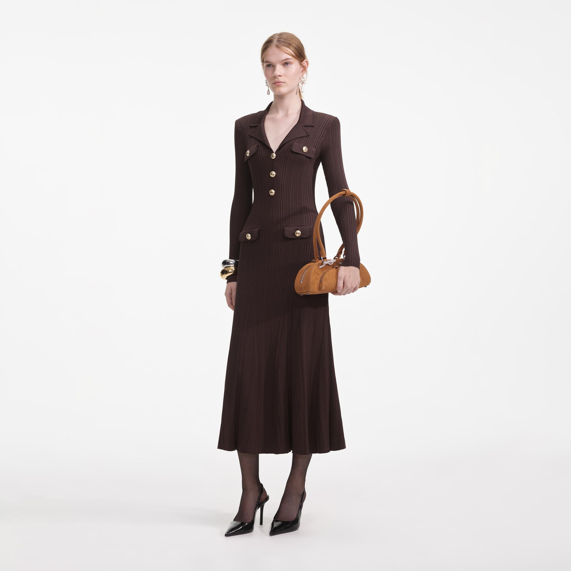 Side view of a woman wearing the Brown Viscose Rib Knit Midi Dress