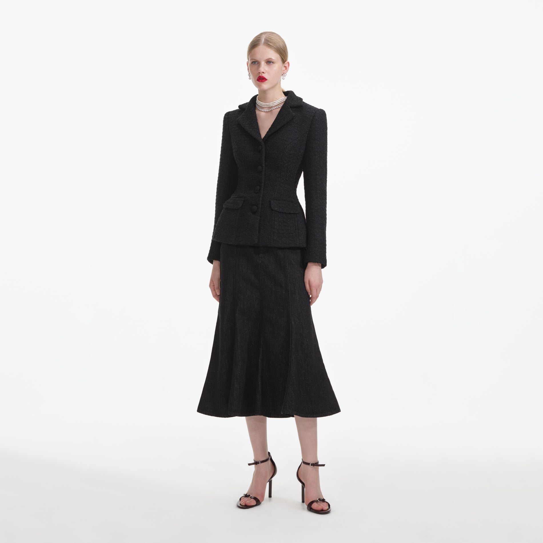 Side view of a woman wearing the Black Boucle Jacket