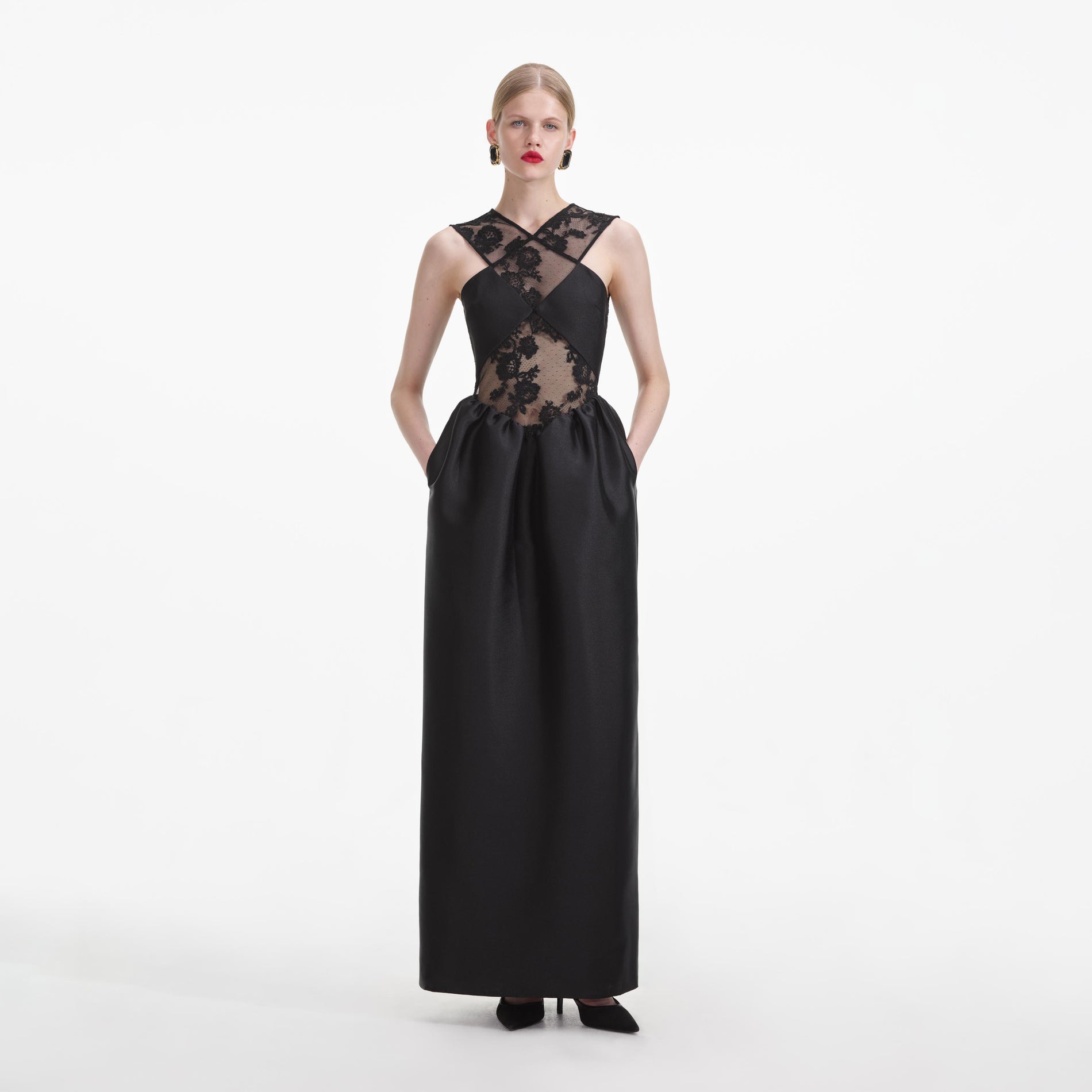 A close up of a woman wearing the Black Lace Taffeta Maxi Dress