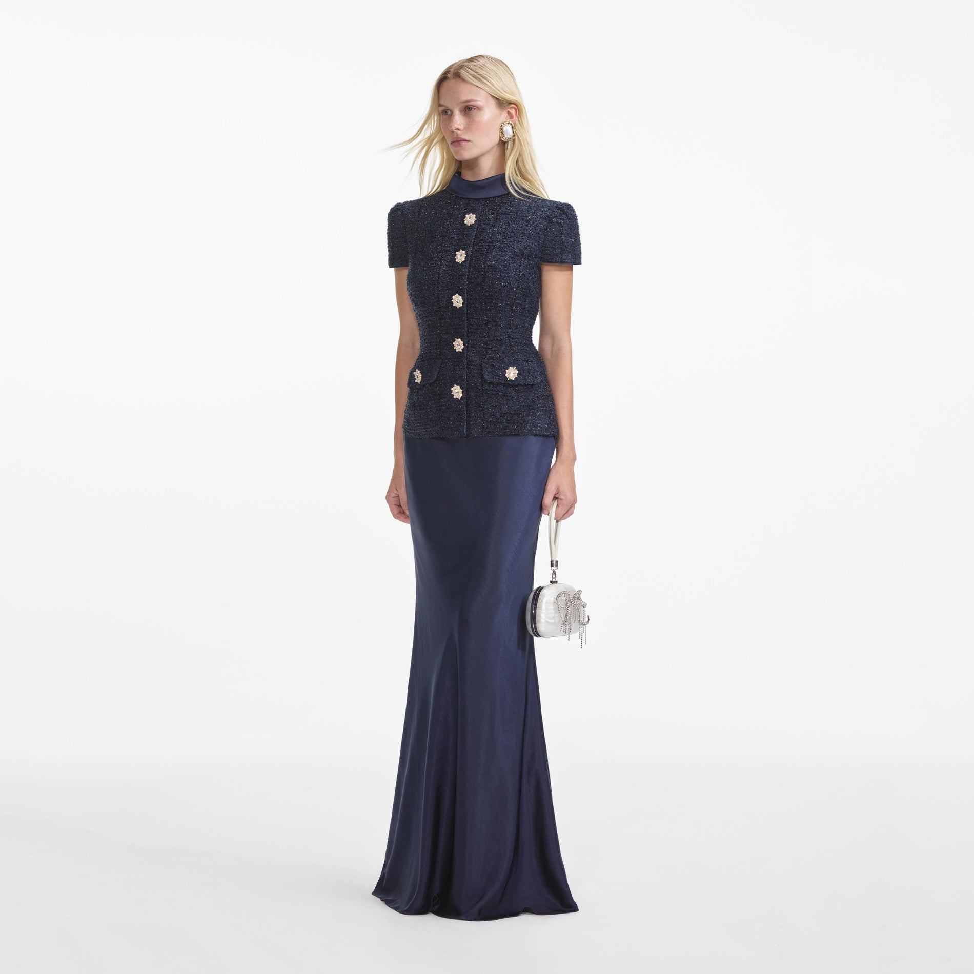 Side view of a woman wearing the Navy Metallic Boucle Maxi Dress
