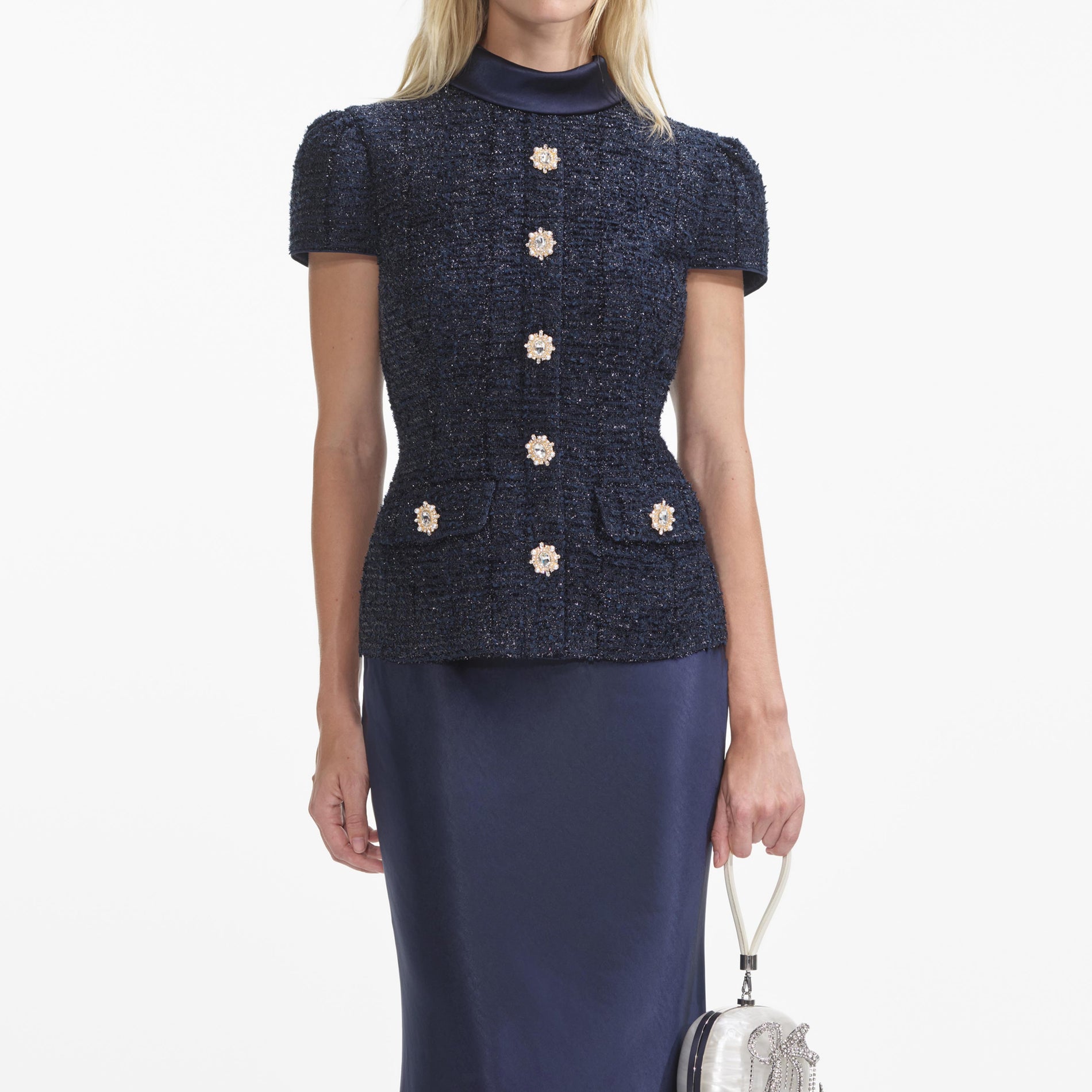 A close up of a woman wearing the Navy Metallic Boucle Maxi Dress