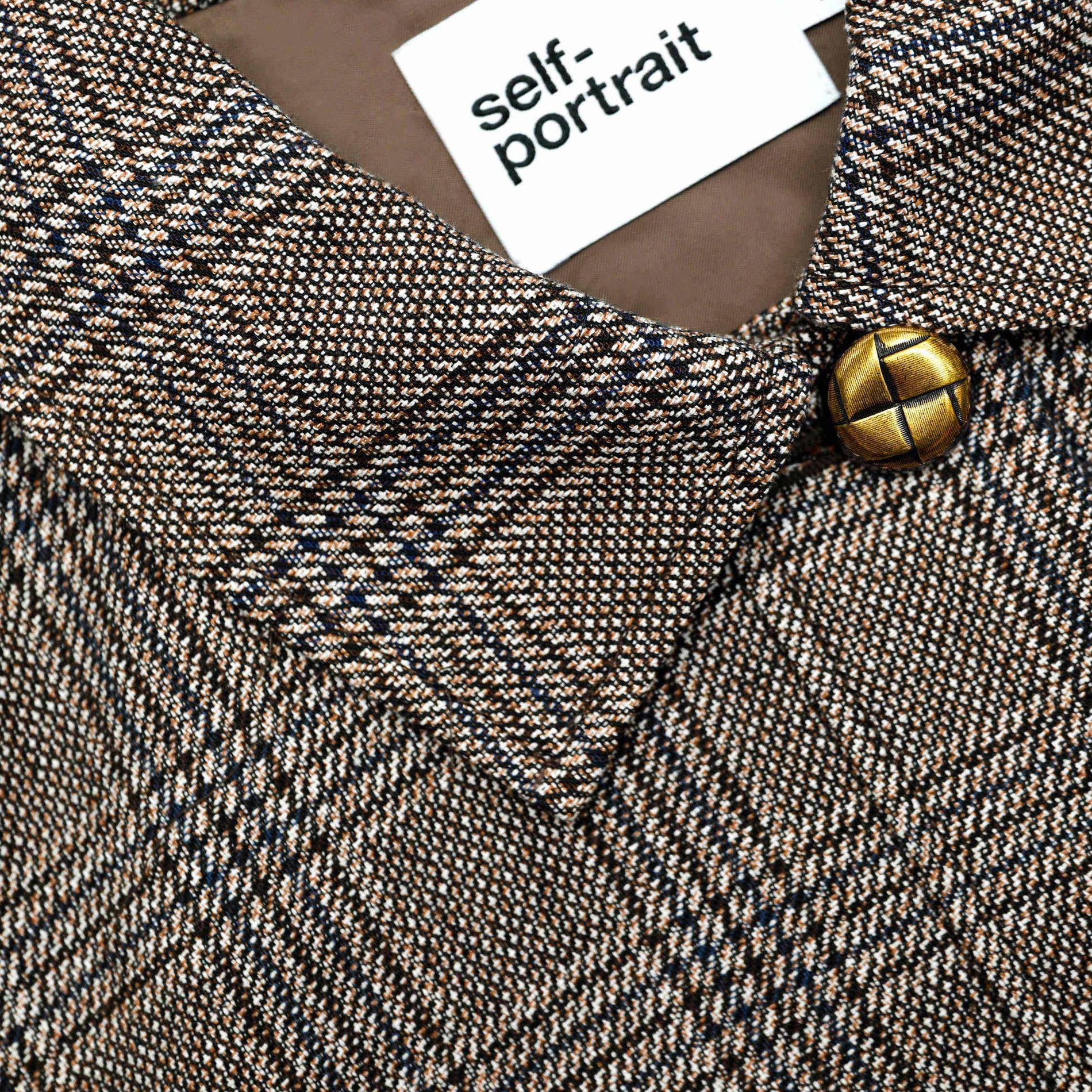 A close up of the fabric for the Brown Check Jacket
